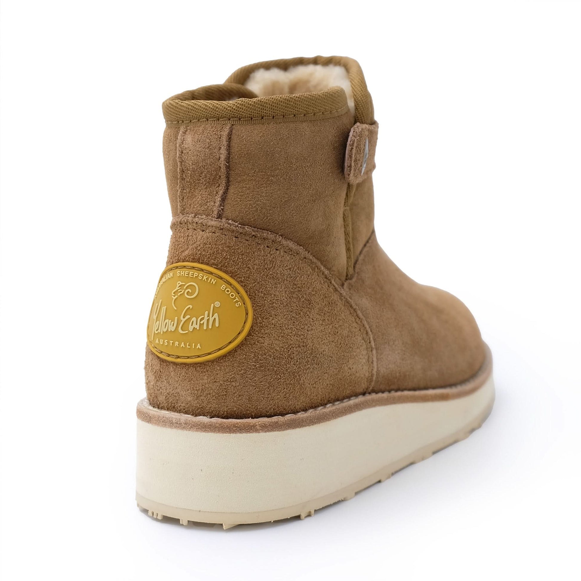 Tan sheepskin ankle boot with cream fleece lining, shown from rear three-quarter view. - Yellow Earth Australia