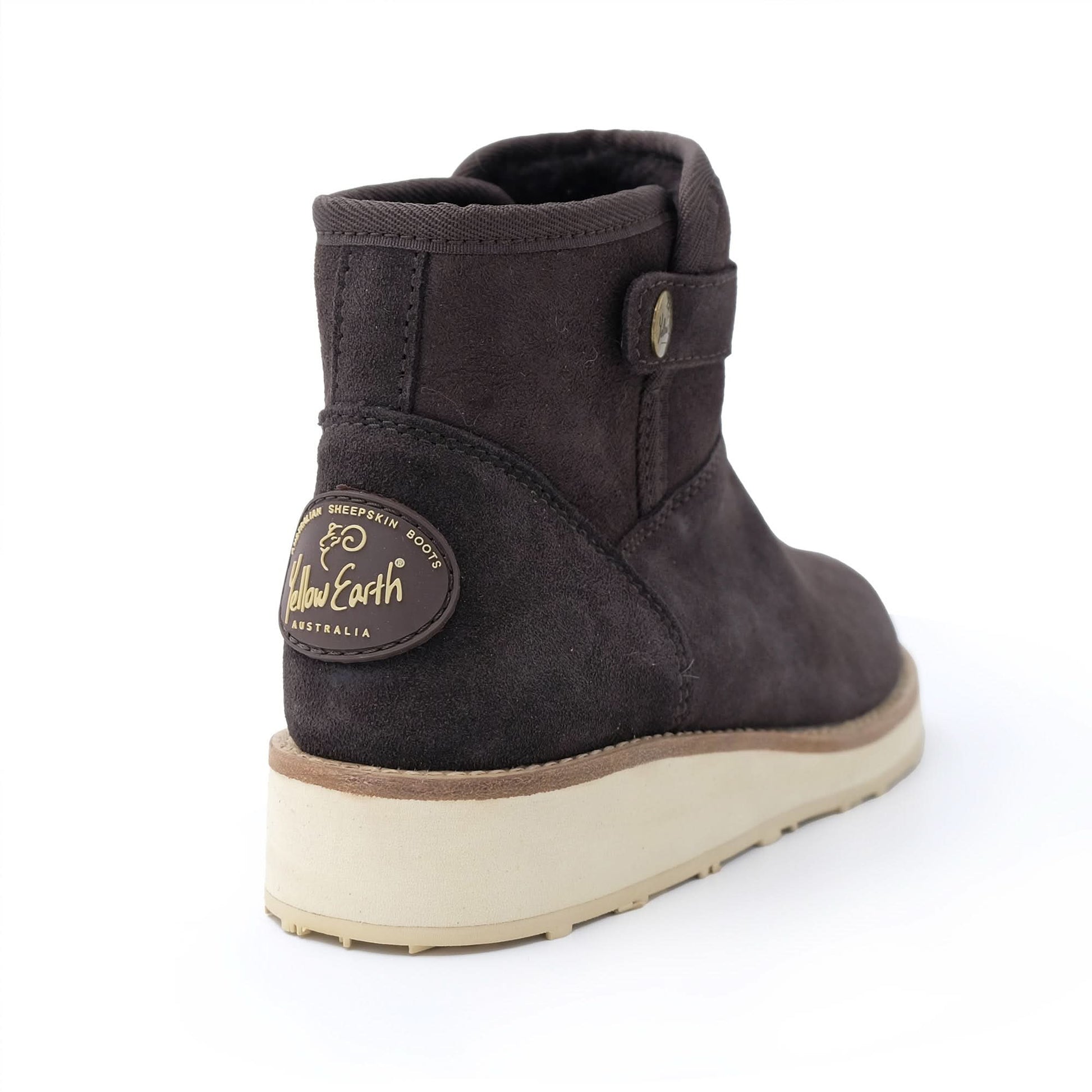 Black sheepskin ankle boot with cream sole, rear view showing wool lining. - Yellow Earth Australia