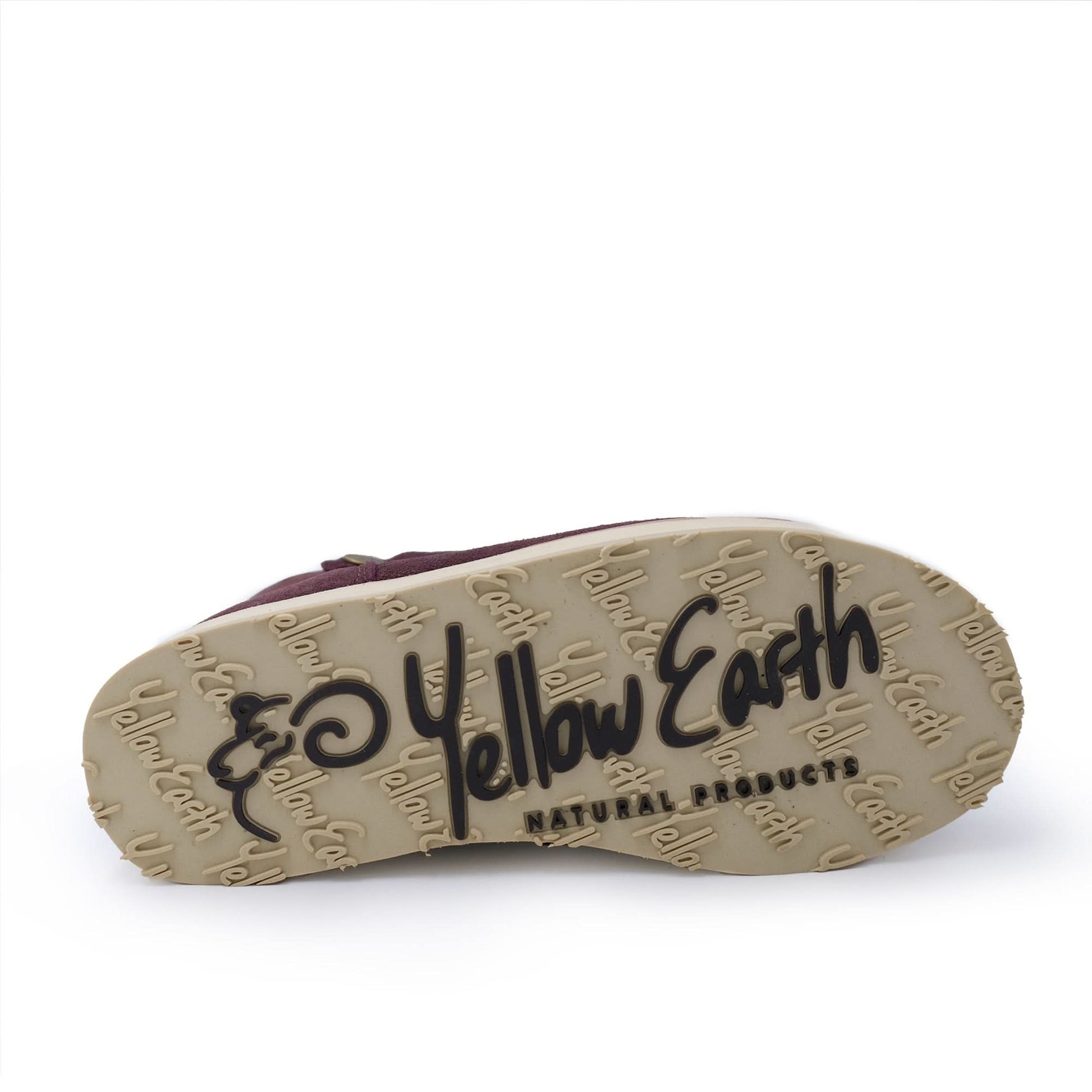 Sheepskin boot with tan sole showing 'Yellow Earth' logo and natural products text.
