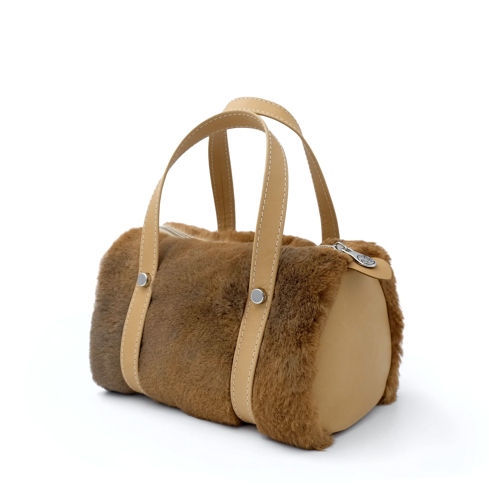 Camel sheepskin handbag with leather handles, front three-quarter view. - Yellow Earth Australia
