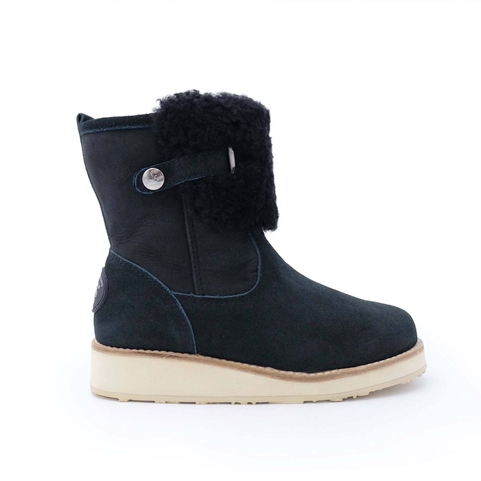 Black sheepskin ankle boot with wool lining and cream sole, side view. - Yellow Earth Australia