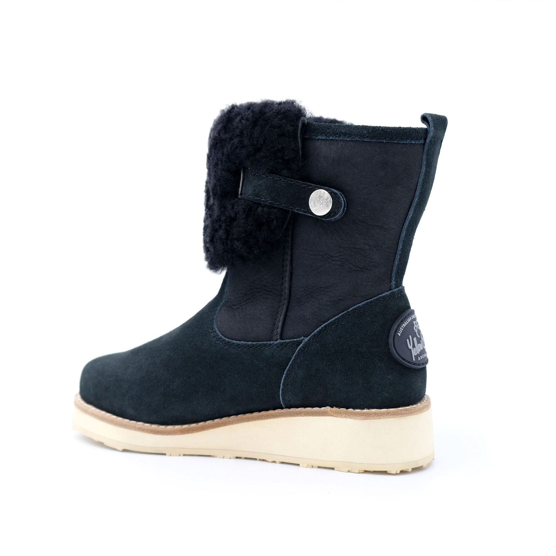 Black sheepskin winter boot with cream sole, rear three-quarter view. - Yellow Earth Australia