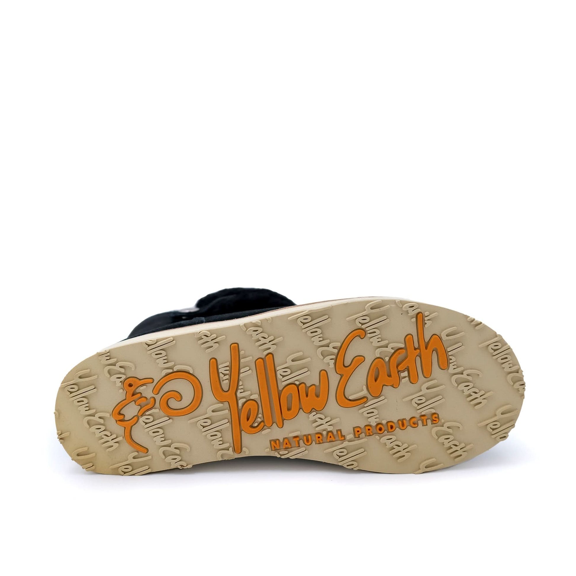 Black sheepskin boots with tan crepe sole, viewed from underneath showing tread pattern. - Yellow Earth Australia