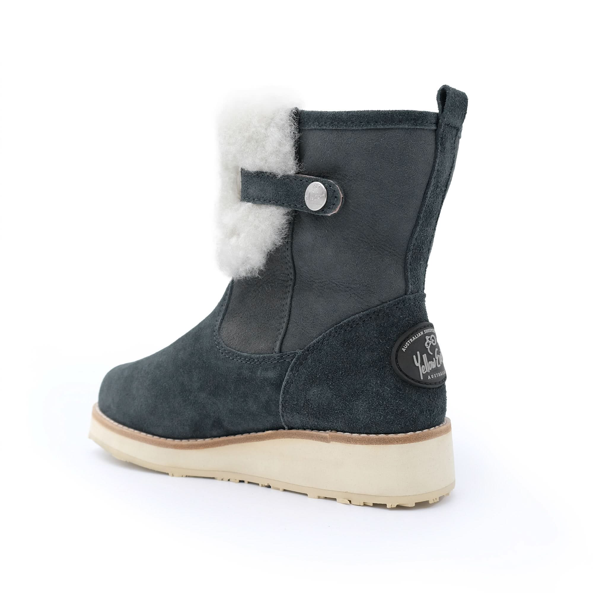 Gunmetal grey sheepskin ankle boot with white fleece lining and side button on white background