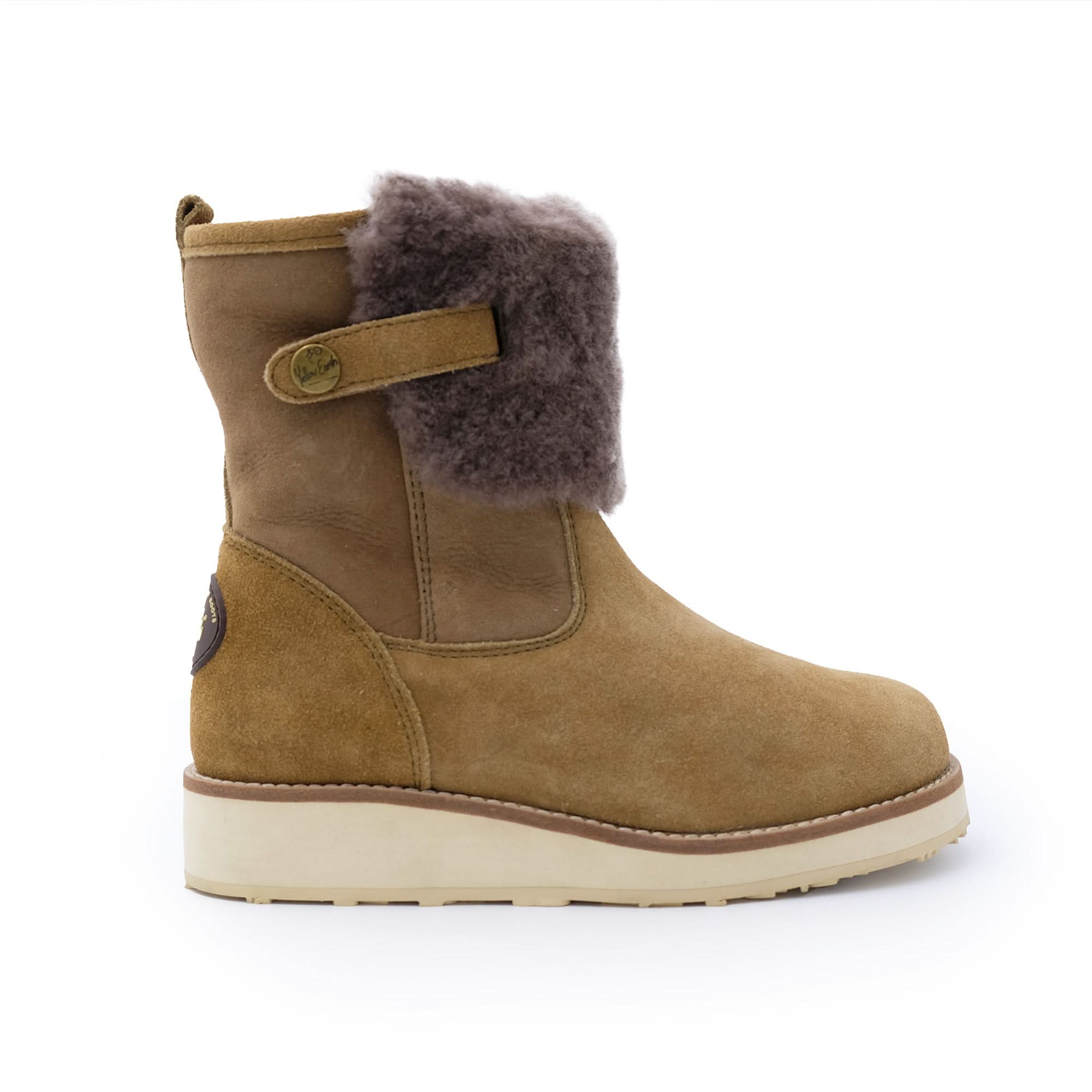 Tan sheepskin mid-calf boot with wool lining, suede finish, and side strap on white background.