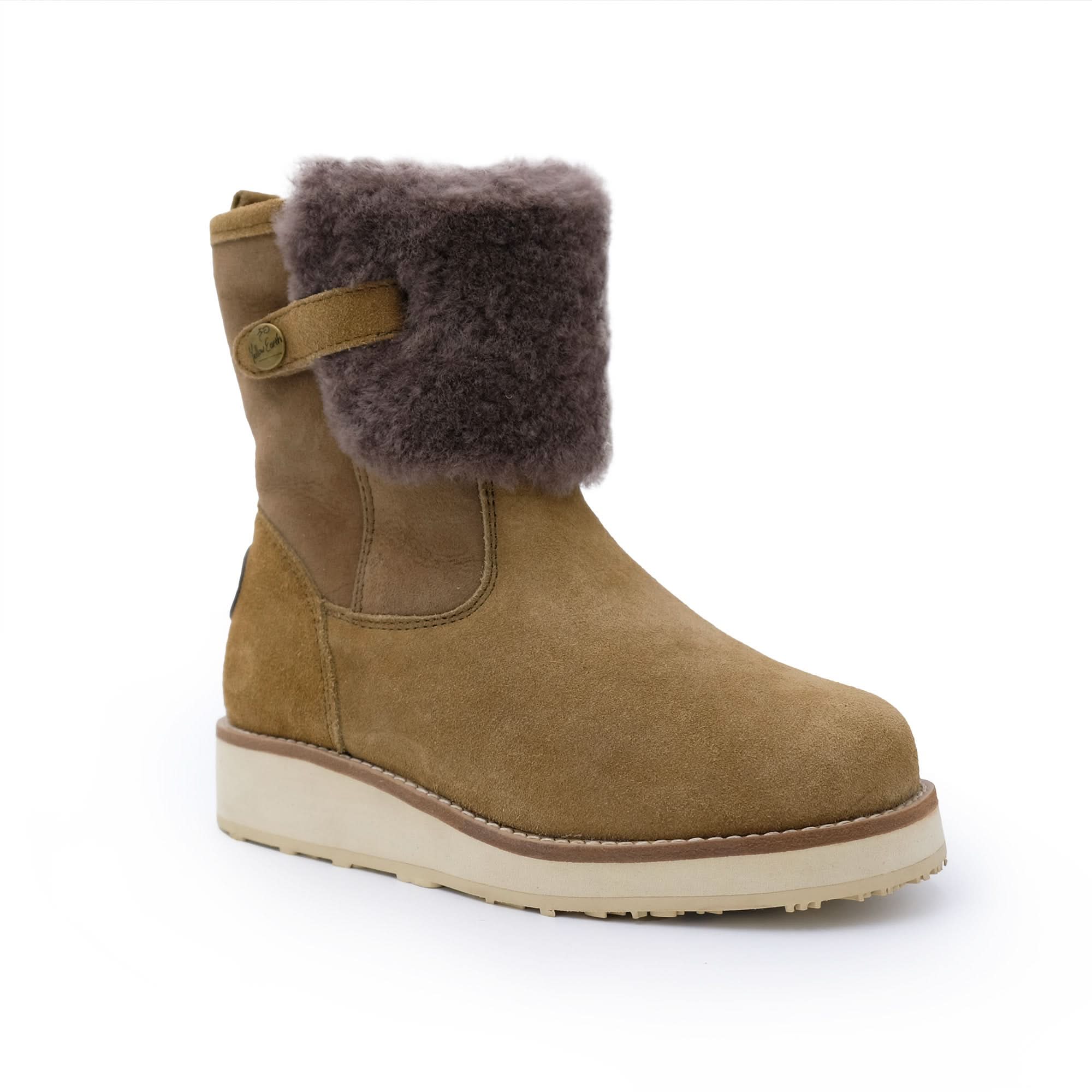 Tan suede sheepskin boot with fold-over dark wool cuff and rubber sole on white background