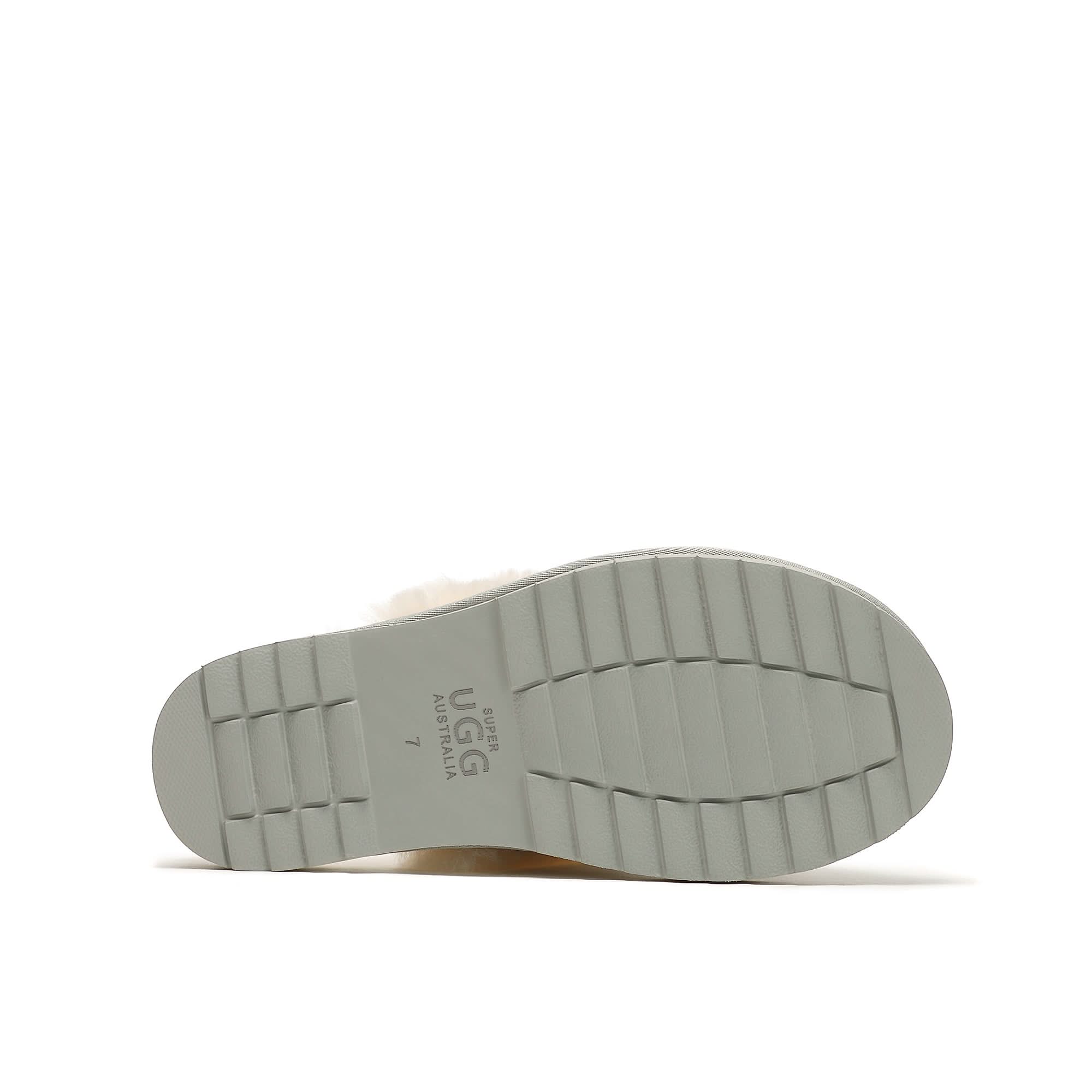 Cream sheepskin slipper sole showing textured white rubber base, bottom view. - Yellow Earth Australia