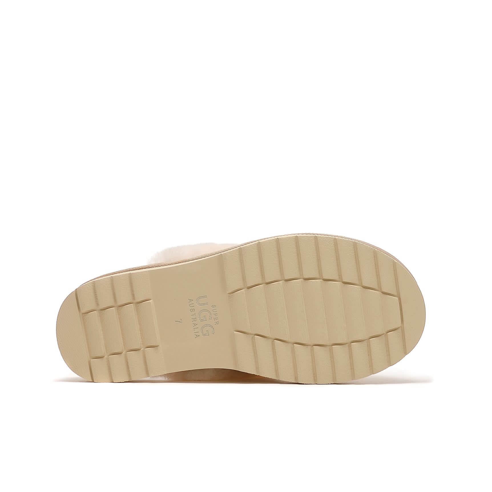 Cream sheepskin slipper sole viewed from underneath showing textured tread pattern. - Yellow Earth Australia