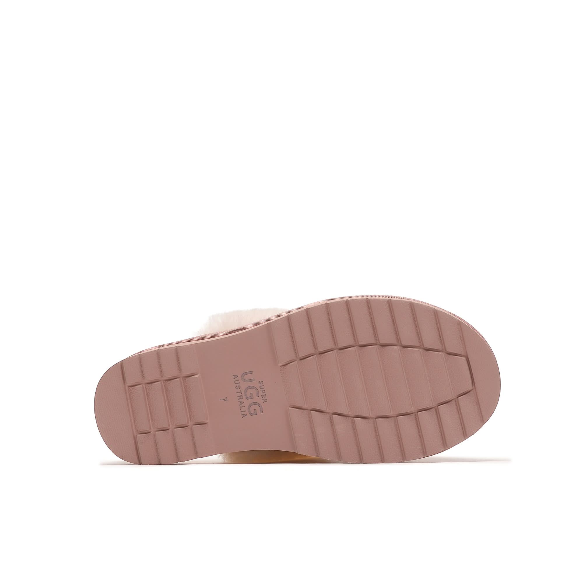 Sole view of a lilac rubber outsole sheepskin slipper with ridged grip pattern