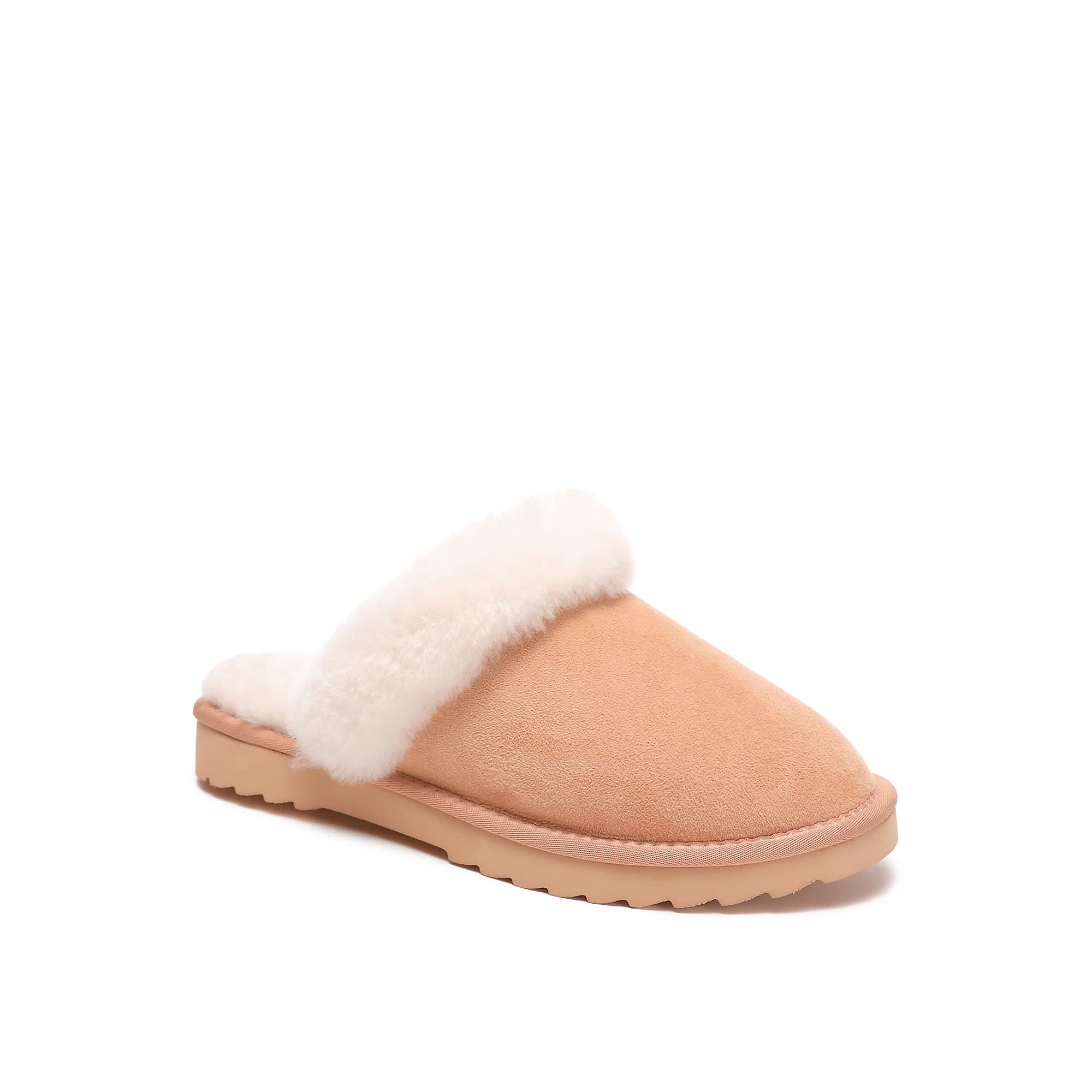 Women's sheepskin scuff slipper in papaya color with plush wool lining on white background
