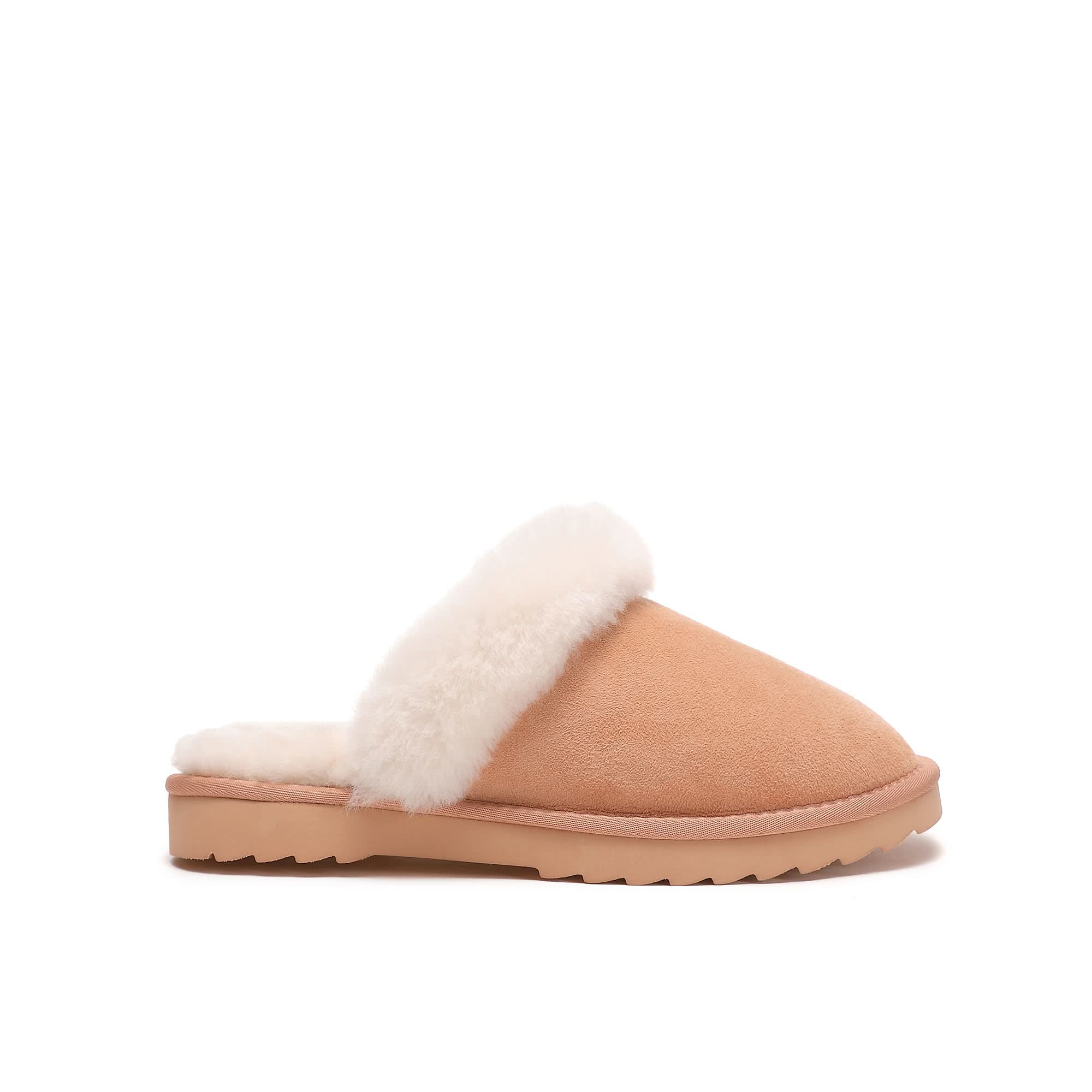 Women's papaya sheepskin scuff slipper with plush white lining and rubber sole on white background