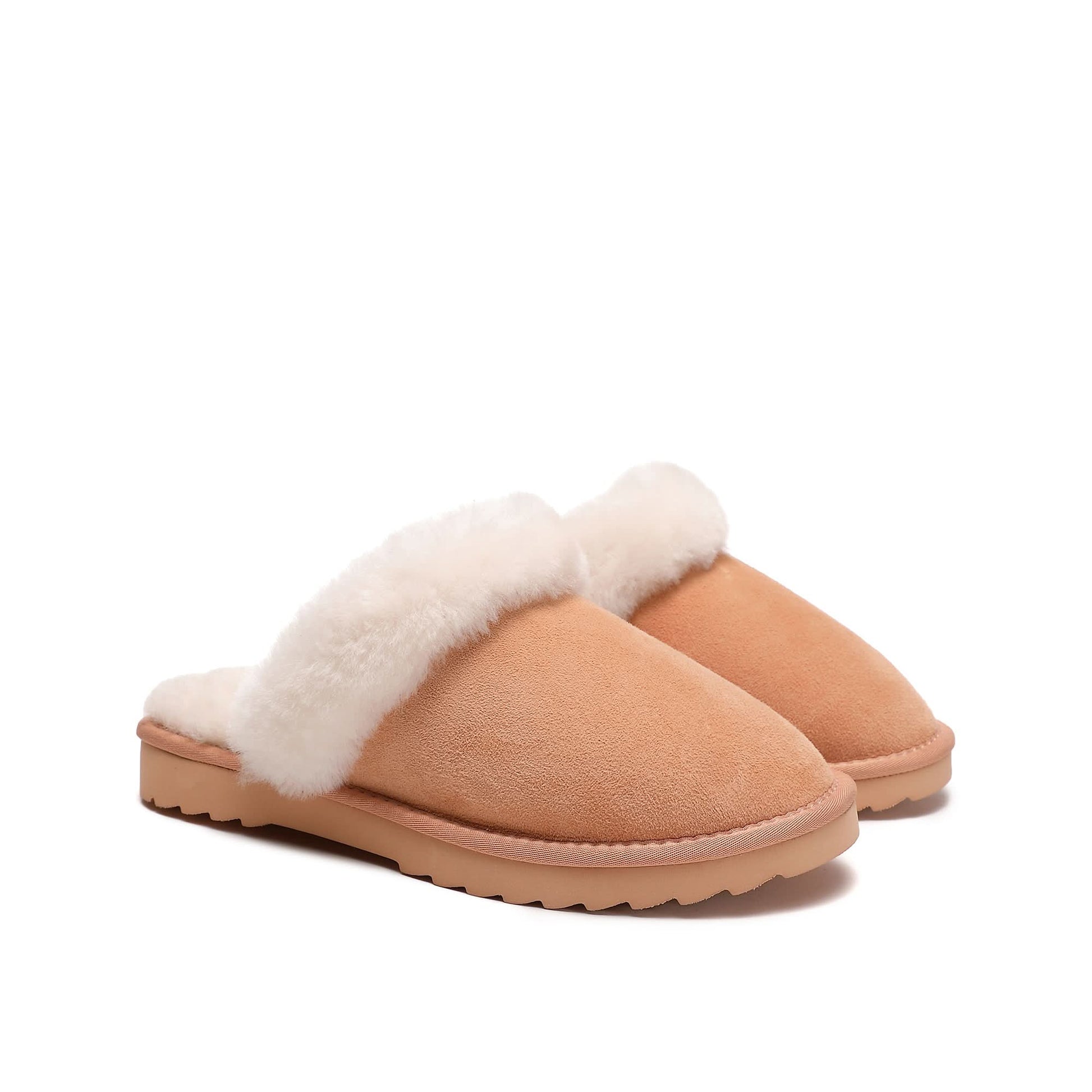 Pair of women's scuff slippers in tan suede with white sheepskin lining on white background