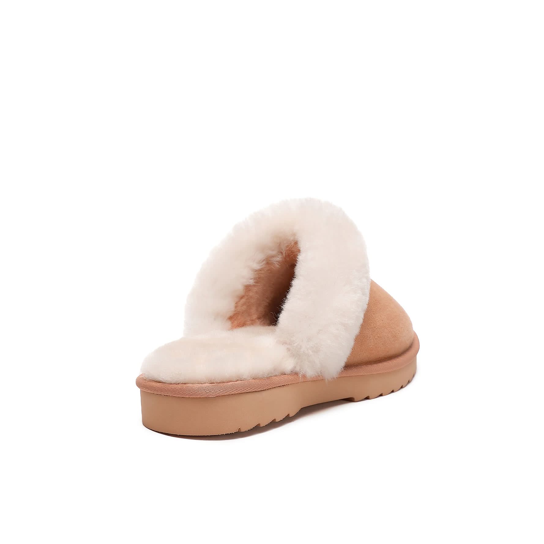 Women's tan sheepskin scuff slipper with cream wool lining on a flat sole, shown on white