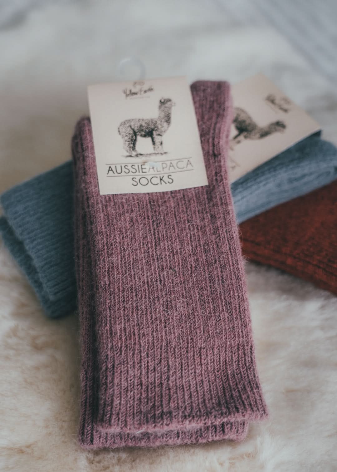 Mauve ribbed alpaca wool socks displayed flat with product tag visible. - Yellow Earth Australia
