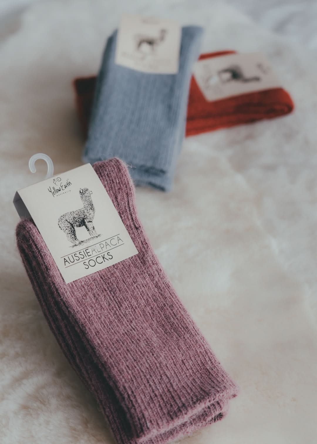 Mauve ribbed alpaca wool socks displayed with packaging and product tag. - Yellow Earth Australia