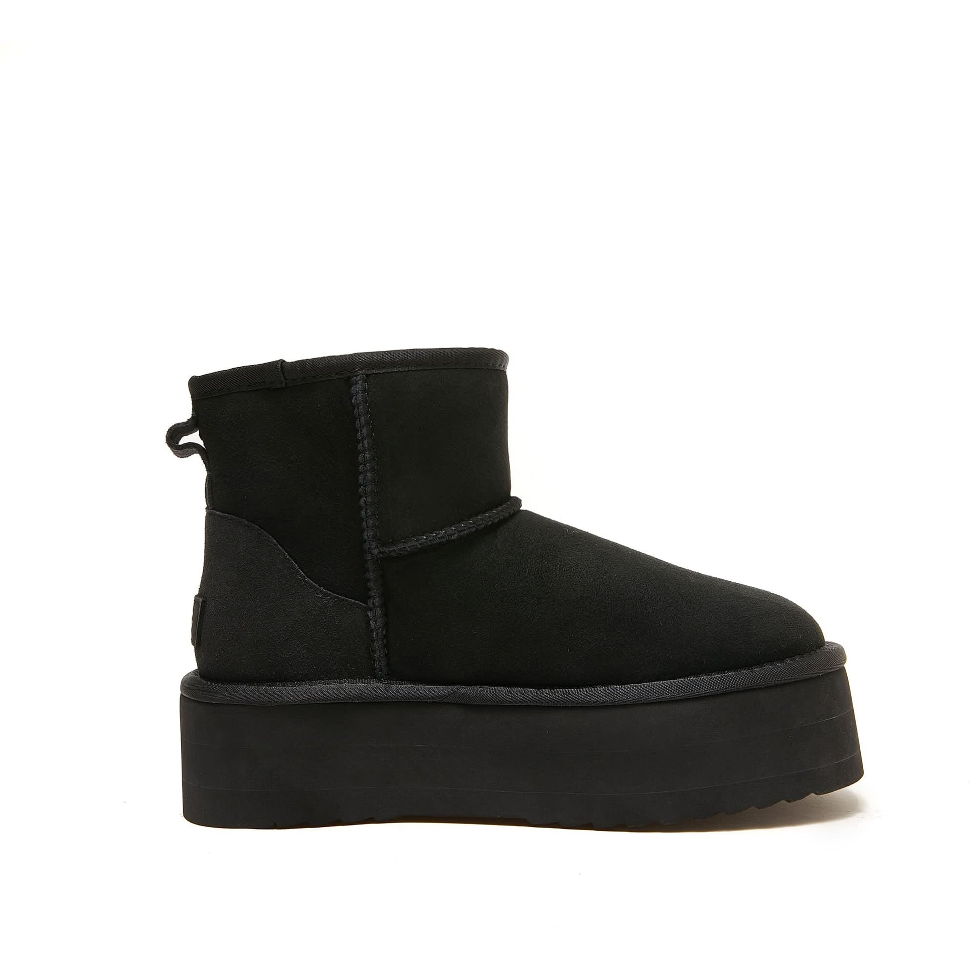 Black suede sheepskin platform mini boot, side view. - Yellow Earth Australia