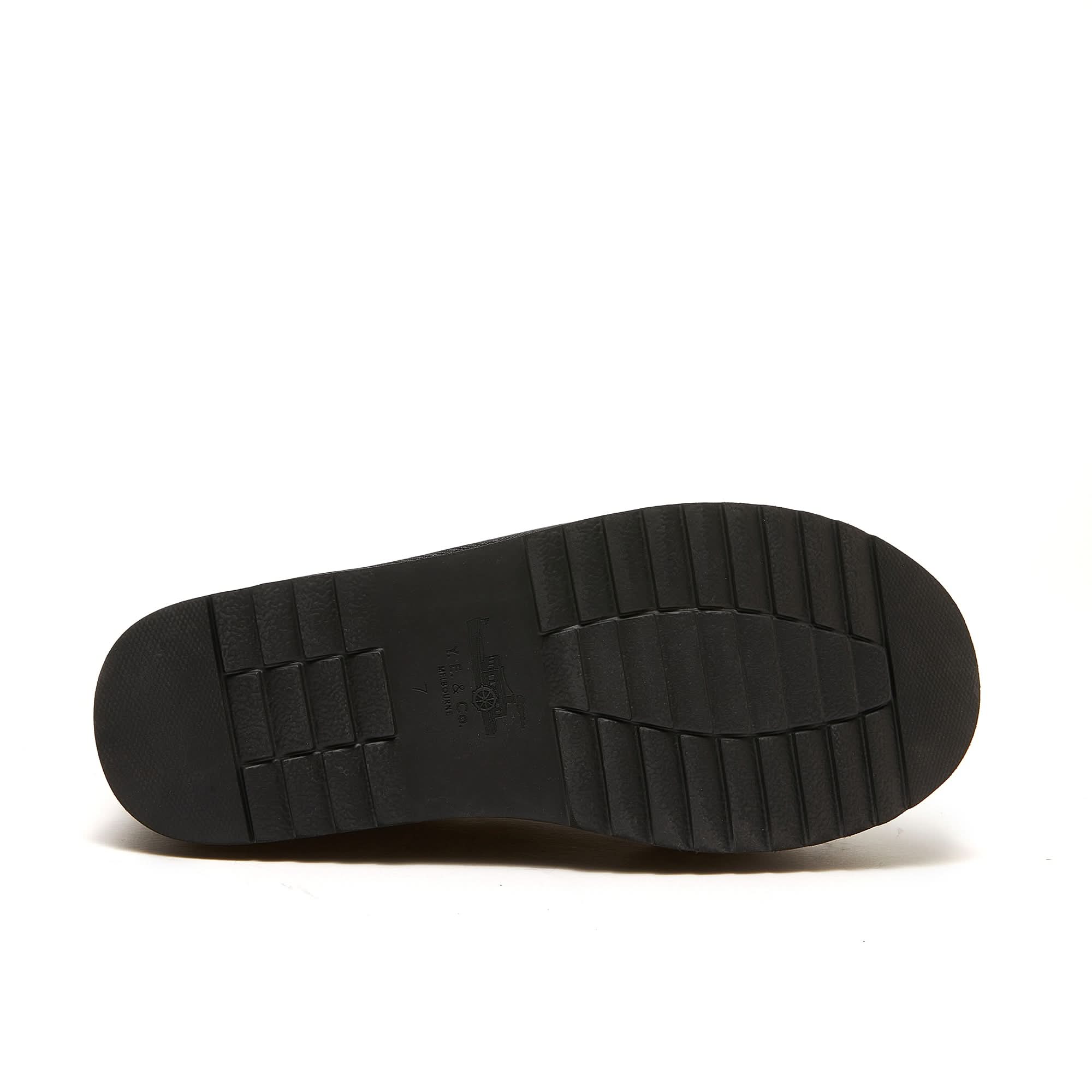 Black sheepskin boot sole showing treaded rubber outsole texture from underneath. - Yellow Earth Australia