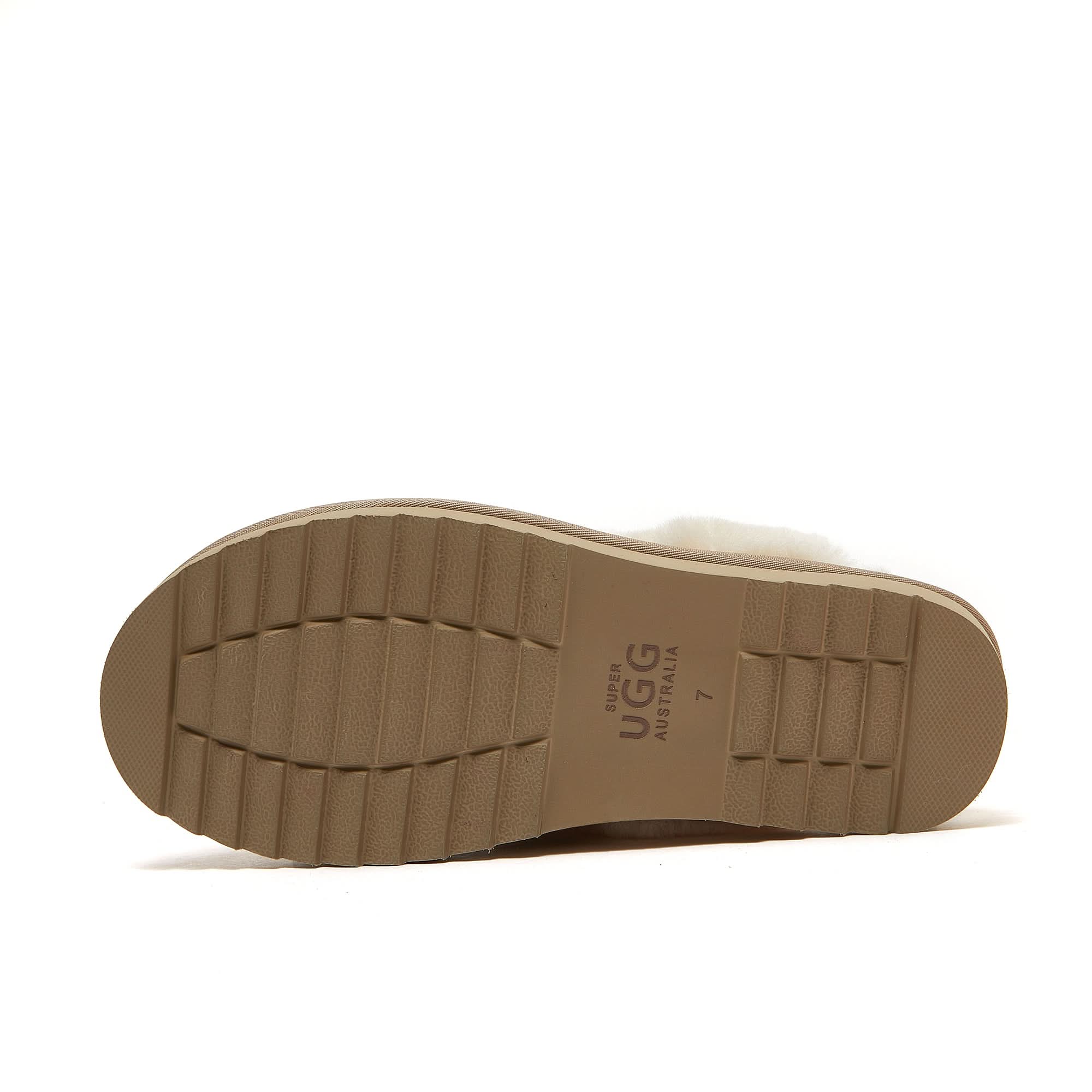Tan sheepskin slipper sole with textured tread, bottom view. - Yellow Earth Australia