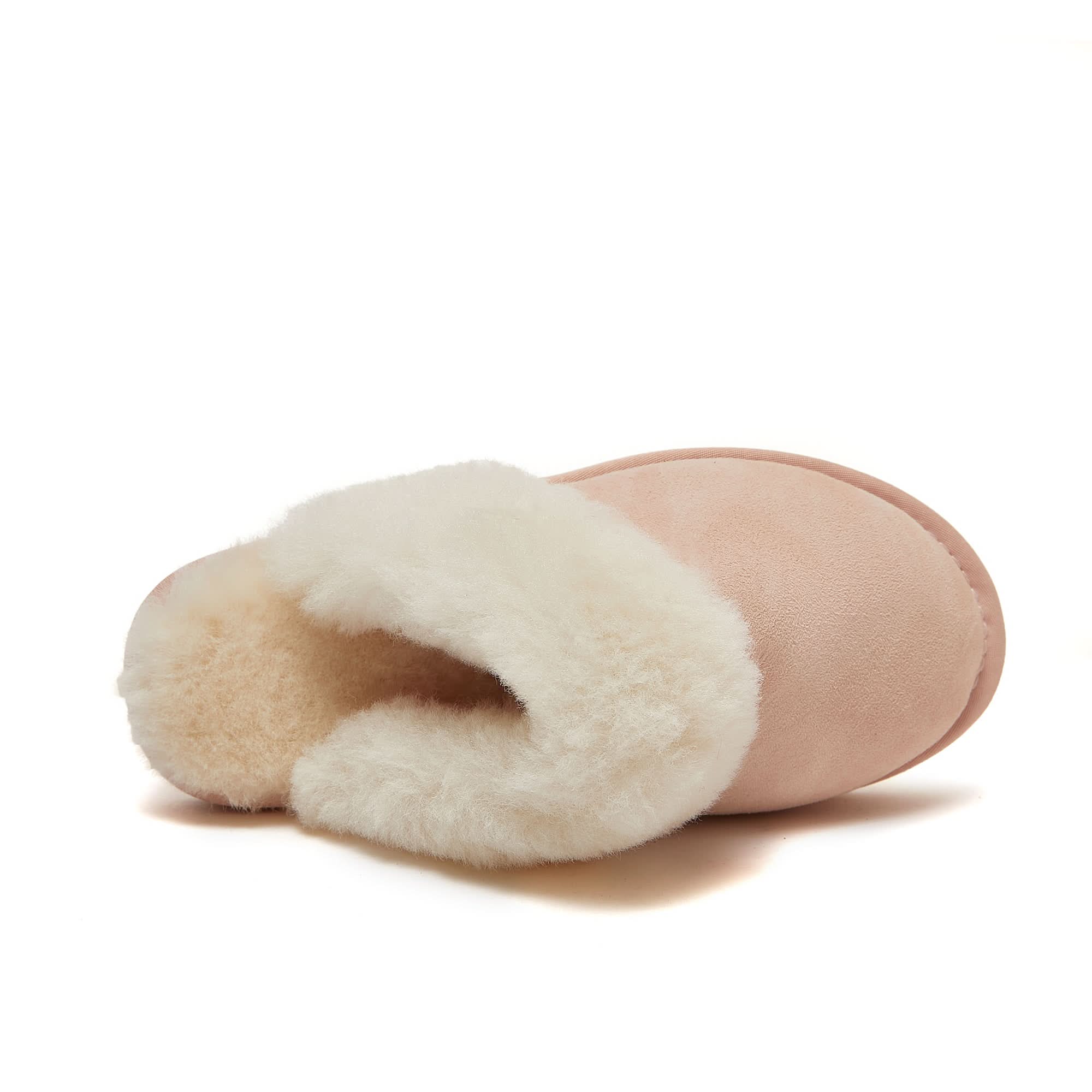 Soft pink sheepskin boot with cream wool lining, angled side view. - Yellow Earth Australia