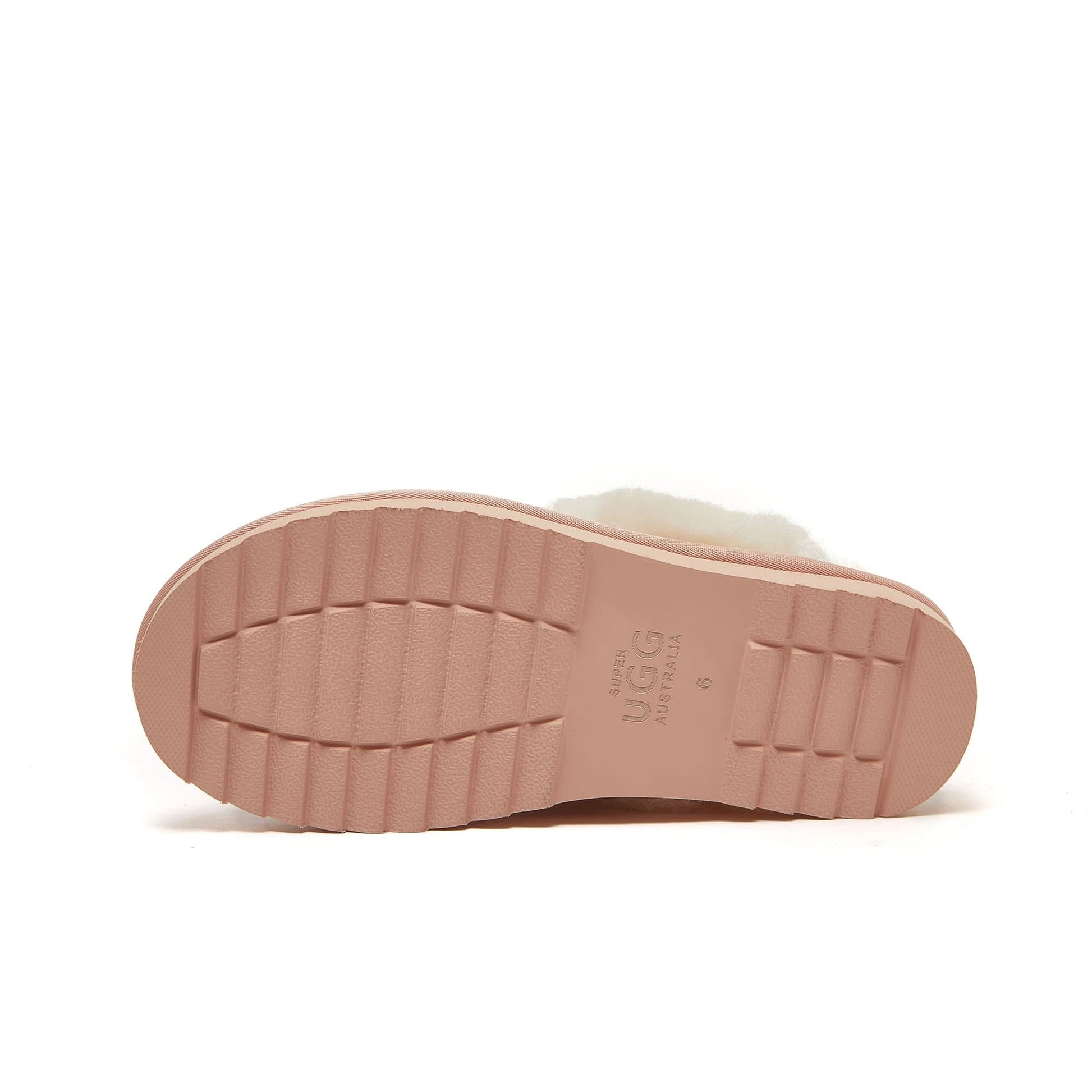 Blush pink sheepskin slipper sole view showing textured rubber tread pattern. - Yellow Earth Australia