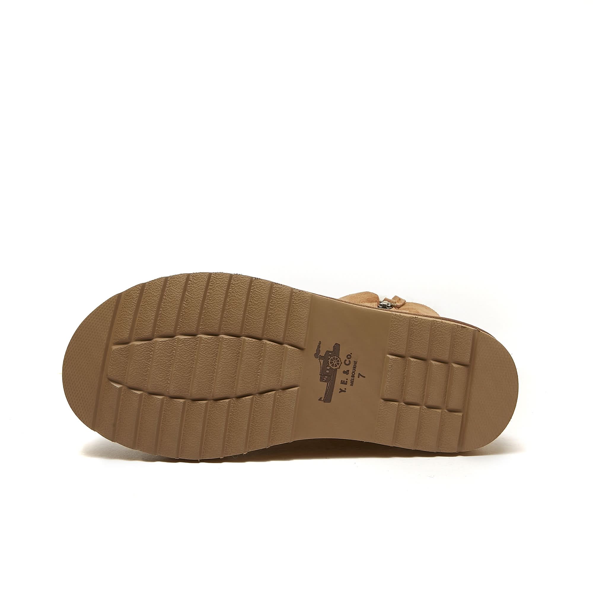 Tan sheepskin boot sole showing textured rubber tread pattern from underneath. - Yellow Earth Australia