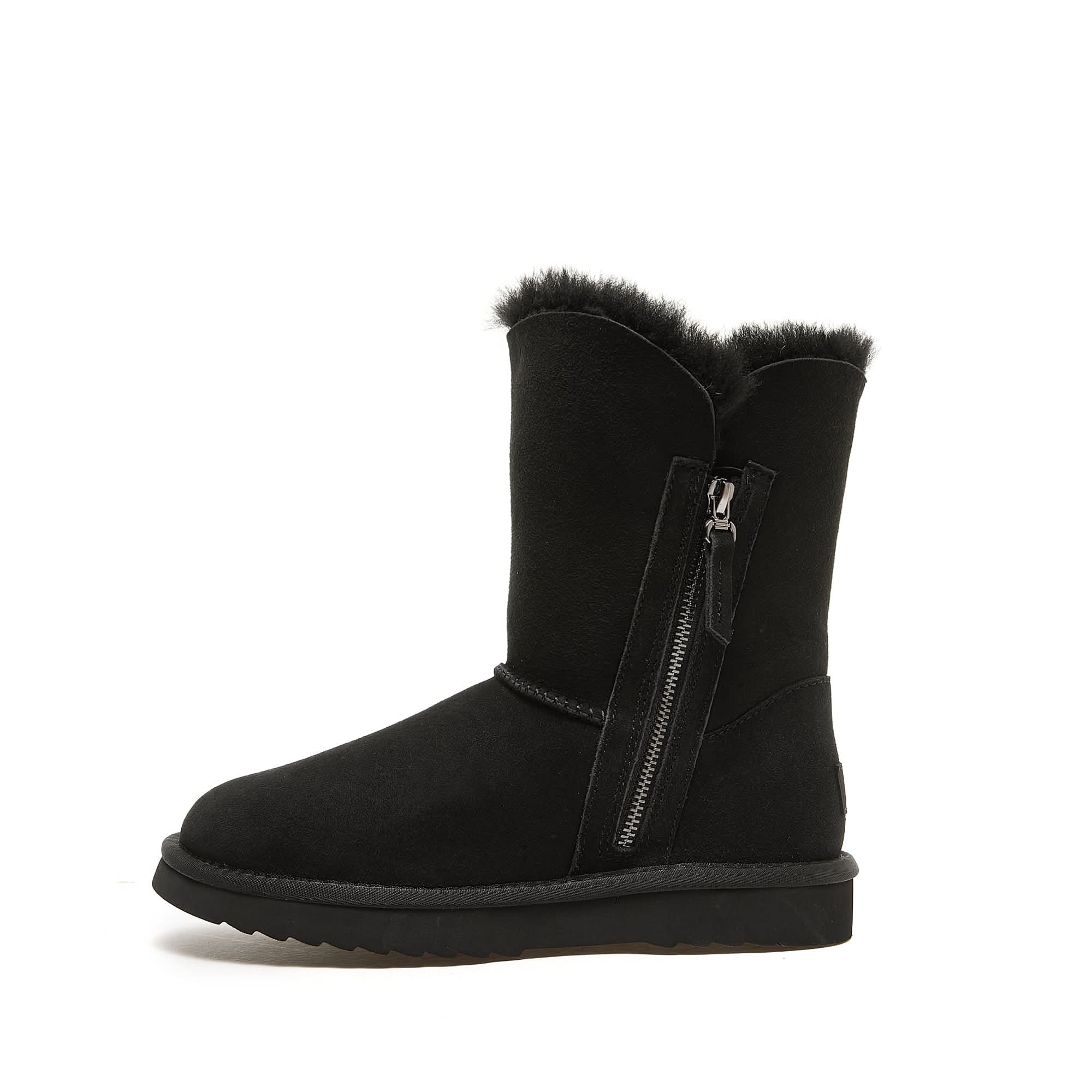 Black sheepskin boot with fur cuff and side zip closure, shown in profile view. - Yellow Earth Australia