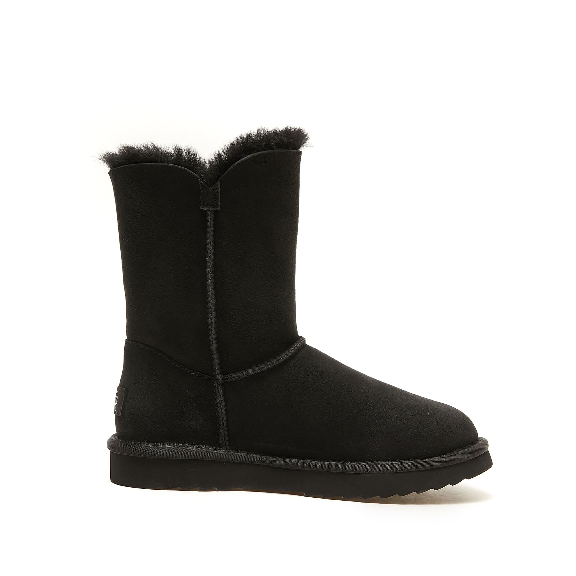 Black sheepskin mid-calf boot with fuzzy wool cuff, side view. - Yellow Earth Australia