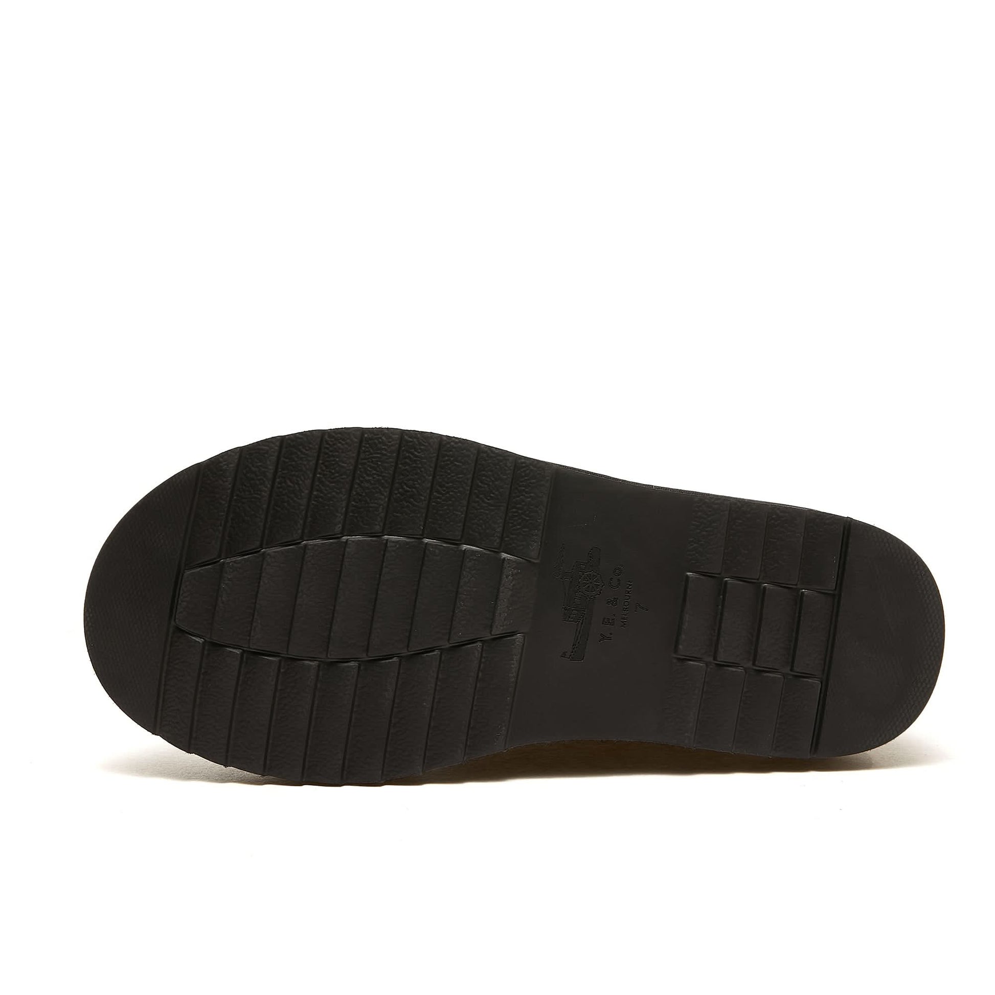 Black sheepskin slipper sole view showing textured rubber outsole. - Yellow Earth Australia