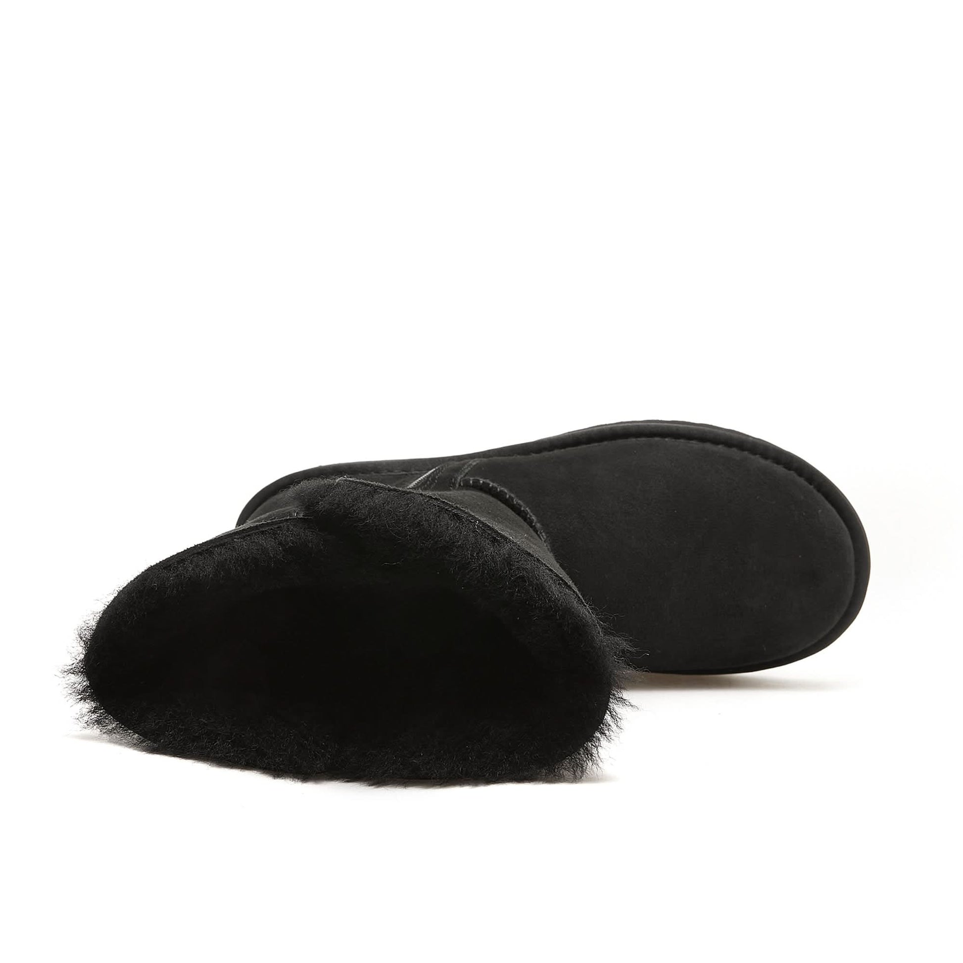 Black sheepskin boots with fluffy wool lining, side view. - Yellow Earth Australia