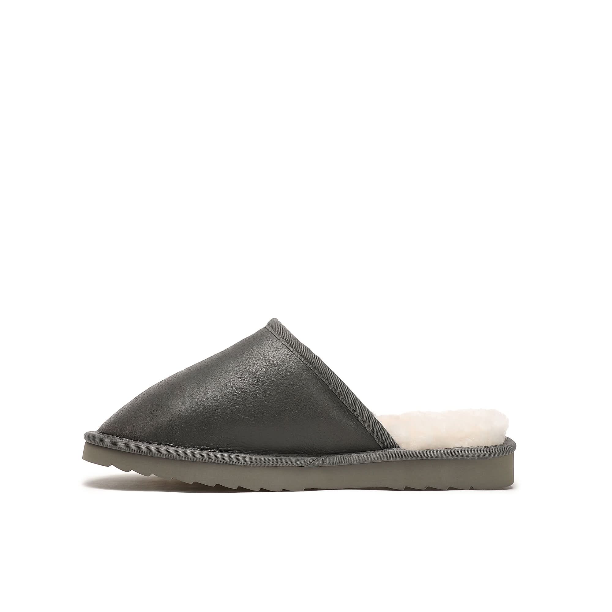 Black leather sheepskin slide slipper with cream wool lining, side view. - Yellow Earth Australia