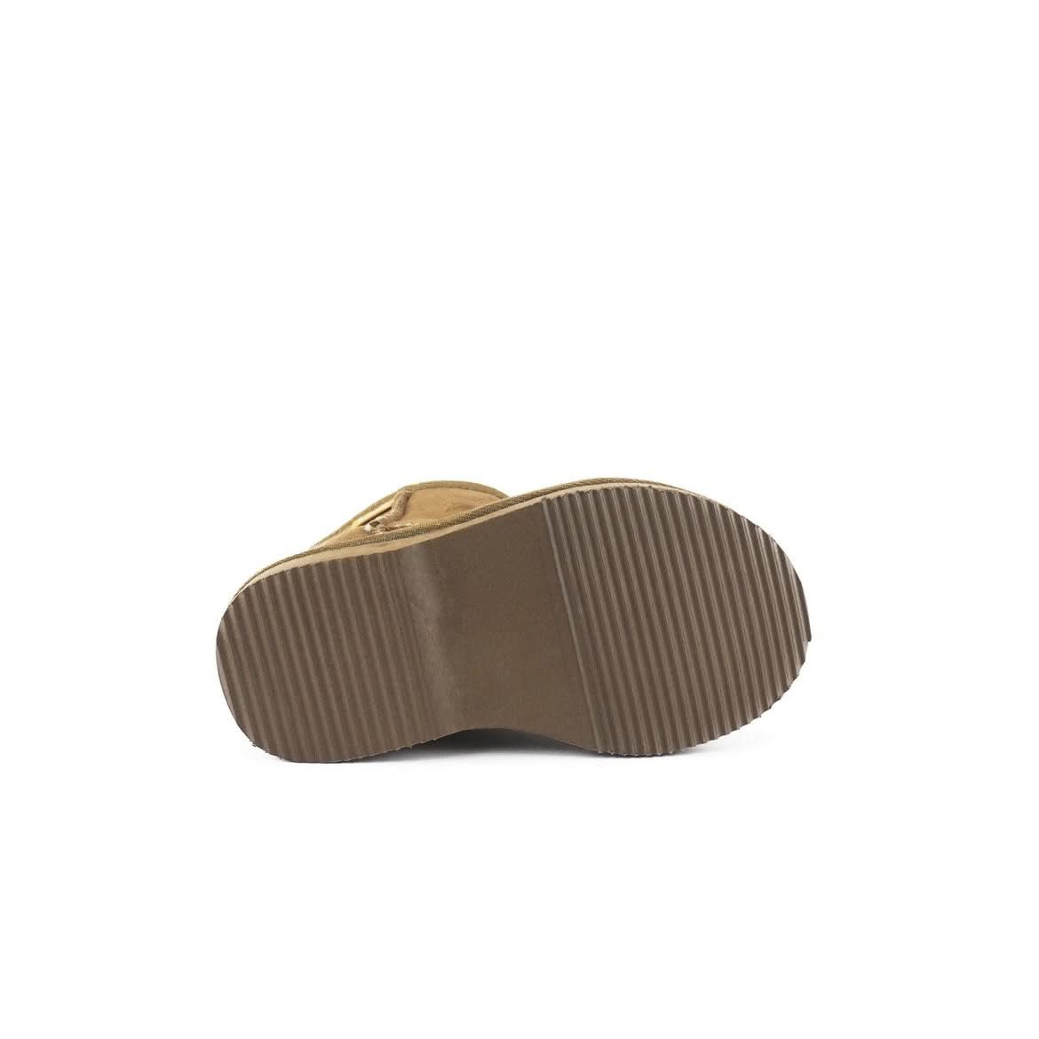 Sheepskin boot sole showing textured brown rubber tread pattern from underside view. - Yellow Earth Australia