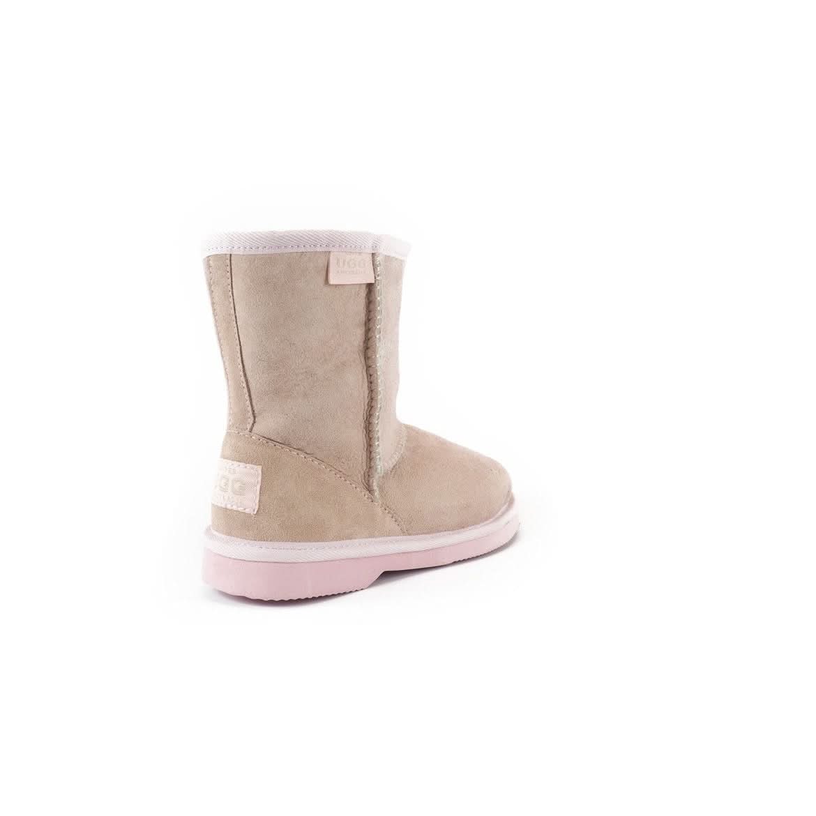 Beige sheepskin boot with pink sole, shown from rear three-quarter view. - Yellow Earth Australia