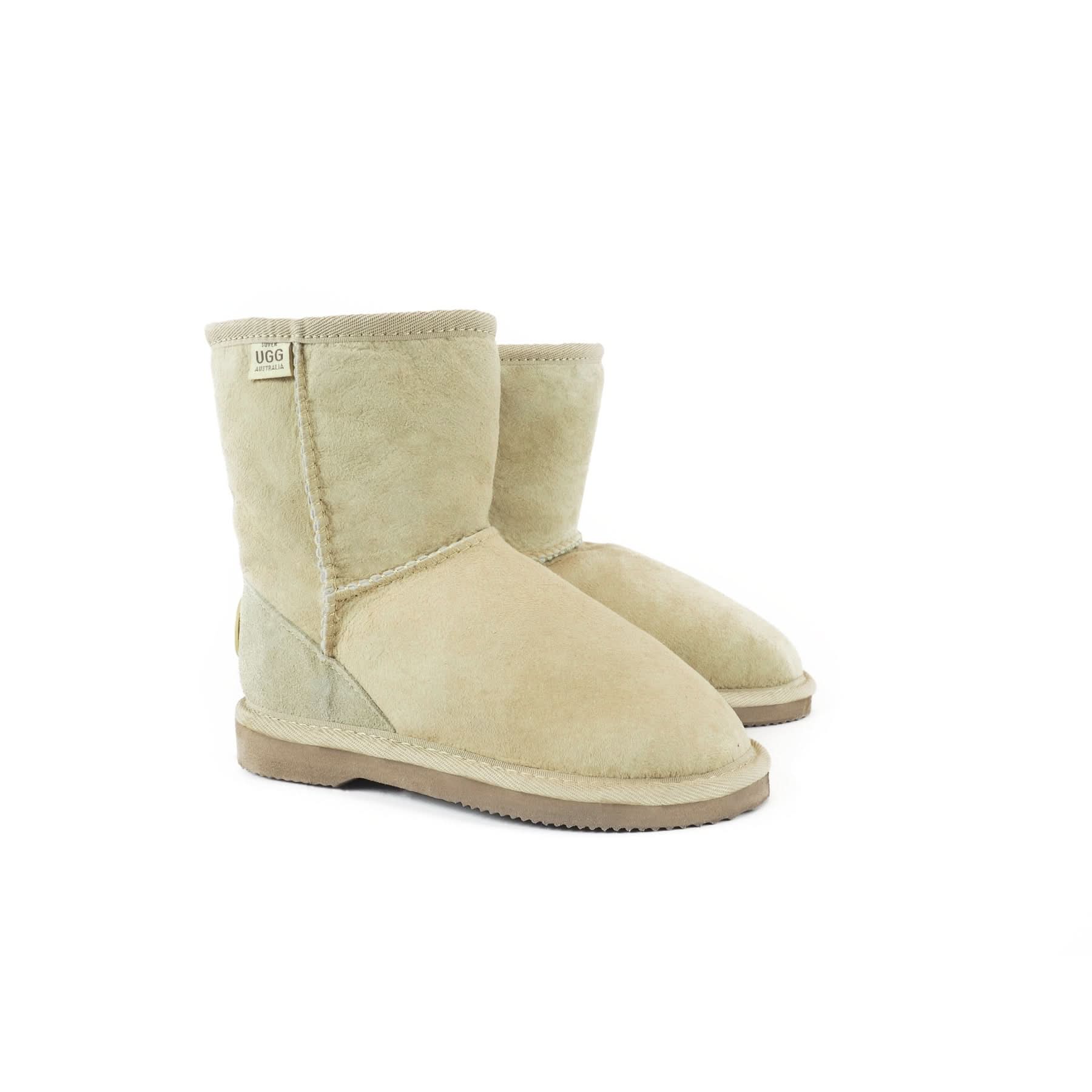 Cream sheepskin mid-calf boots with suede sole, displayed from a front-angled view. - Yellow Earth Australia