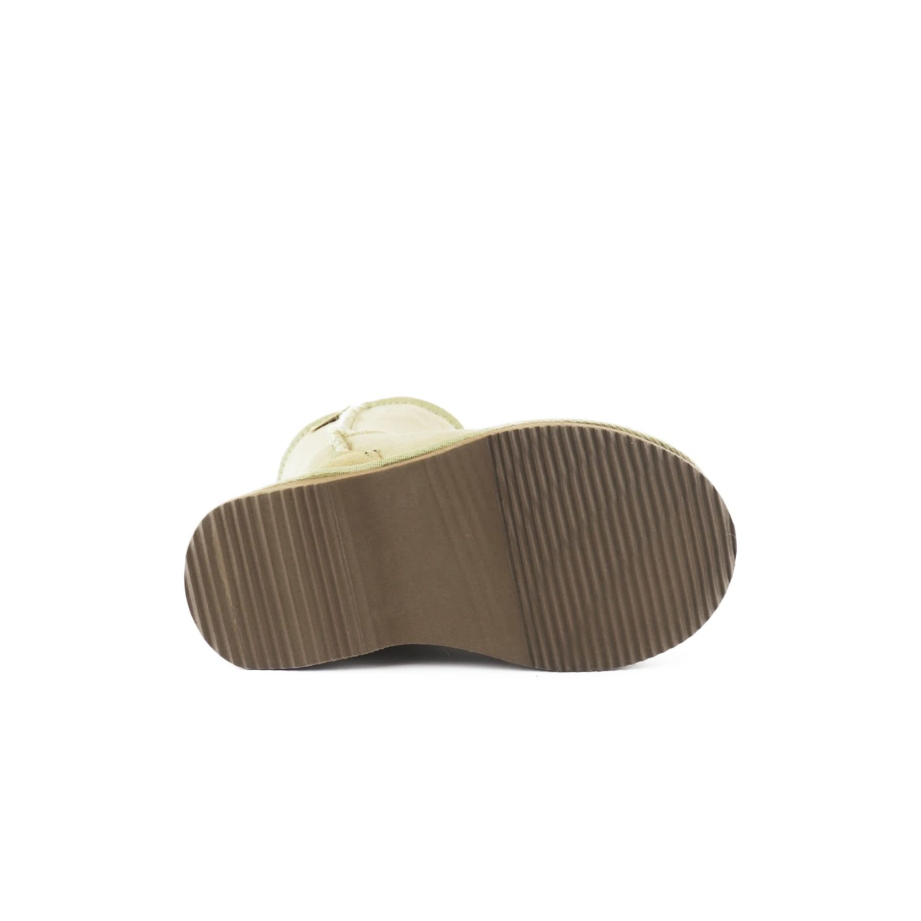 Cream sheepskin boot with visible ribbed sole, shown from underneath sole view. - Yellow Earth Australia