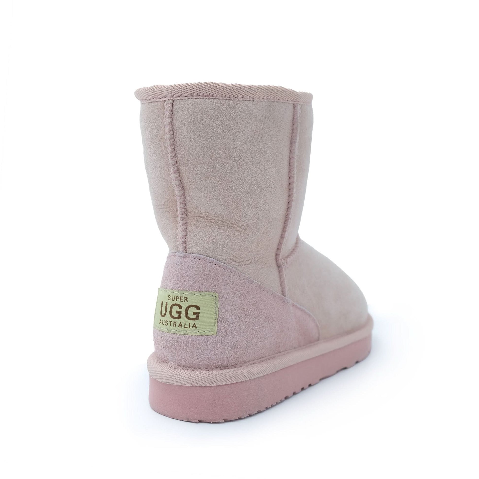 Pale pink sheepskin boot shown from the back angle with suede exterior and wool lining. - Yellow Earth Australia