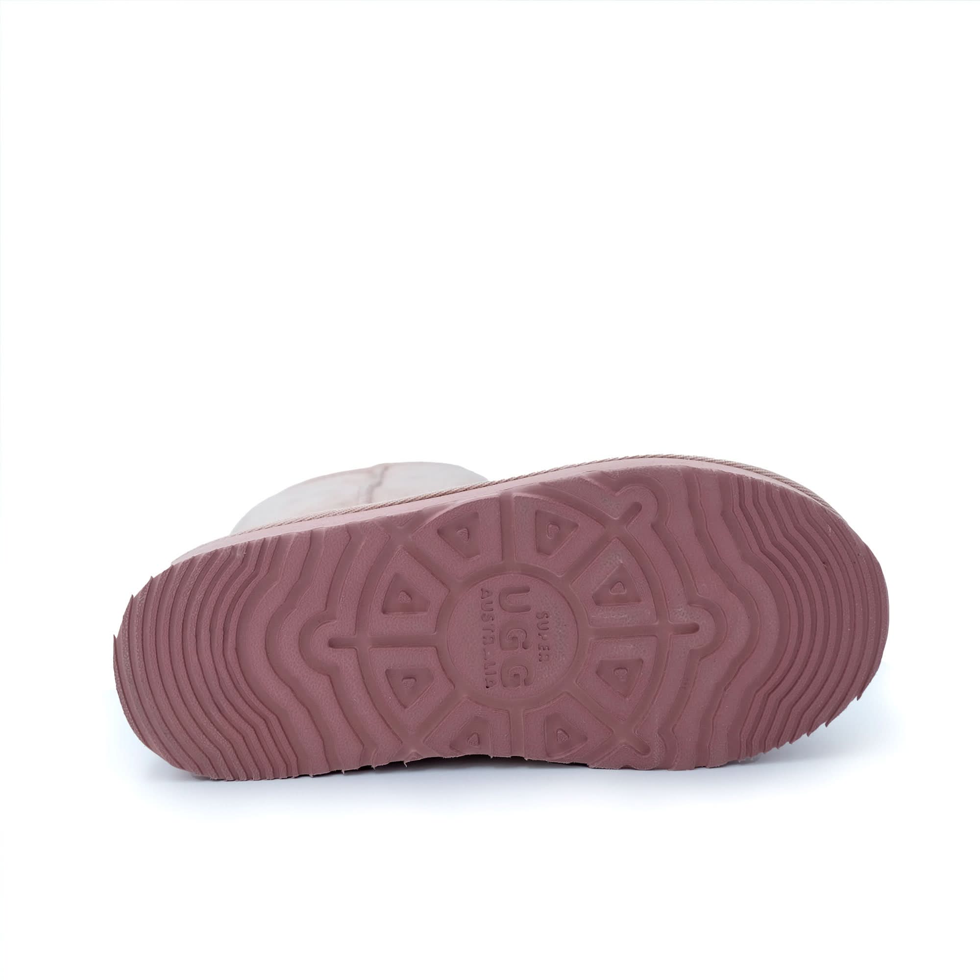 Pink sheepskin baby bootie sole view showing textured rubber outsole. - Yellow Earth Australia