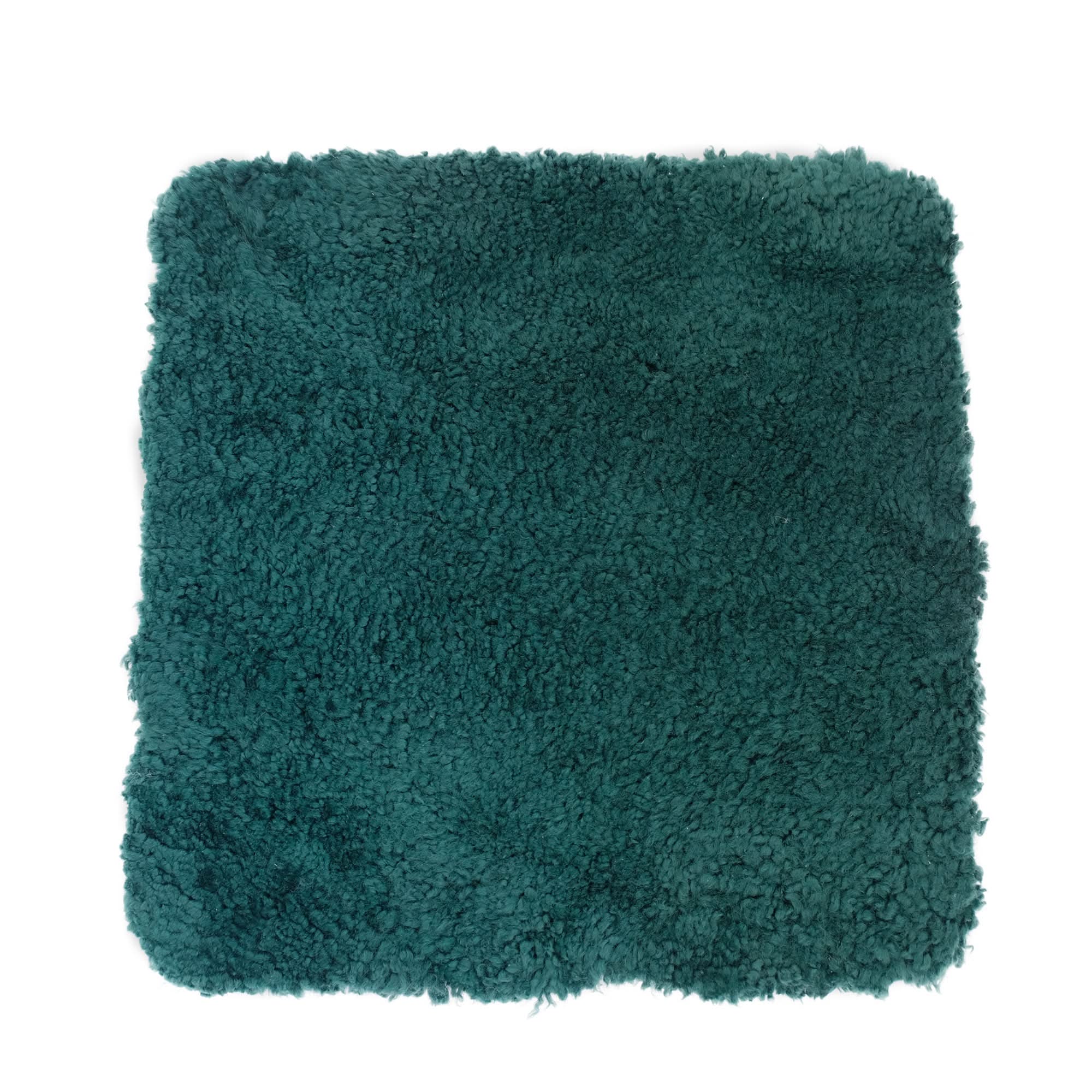 Teal sheepskin rug with fluffy wool pile texture shown flat lay view. - Yellow Earth Australia