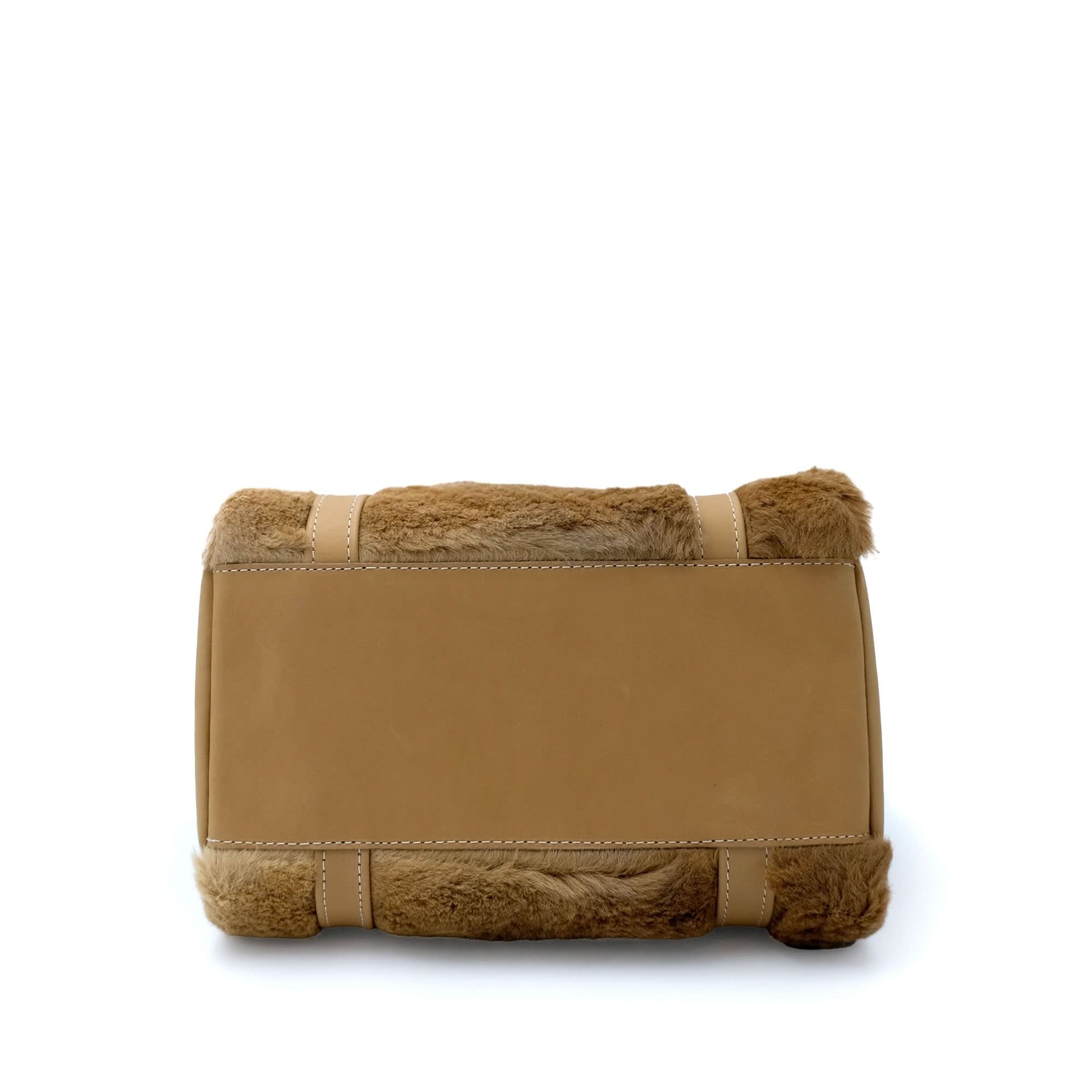Tan leather clutch with sheepskin fur trim, front view. - Yellow Earth Australia