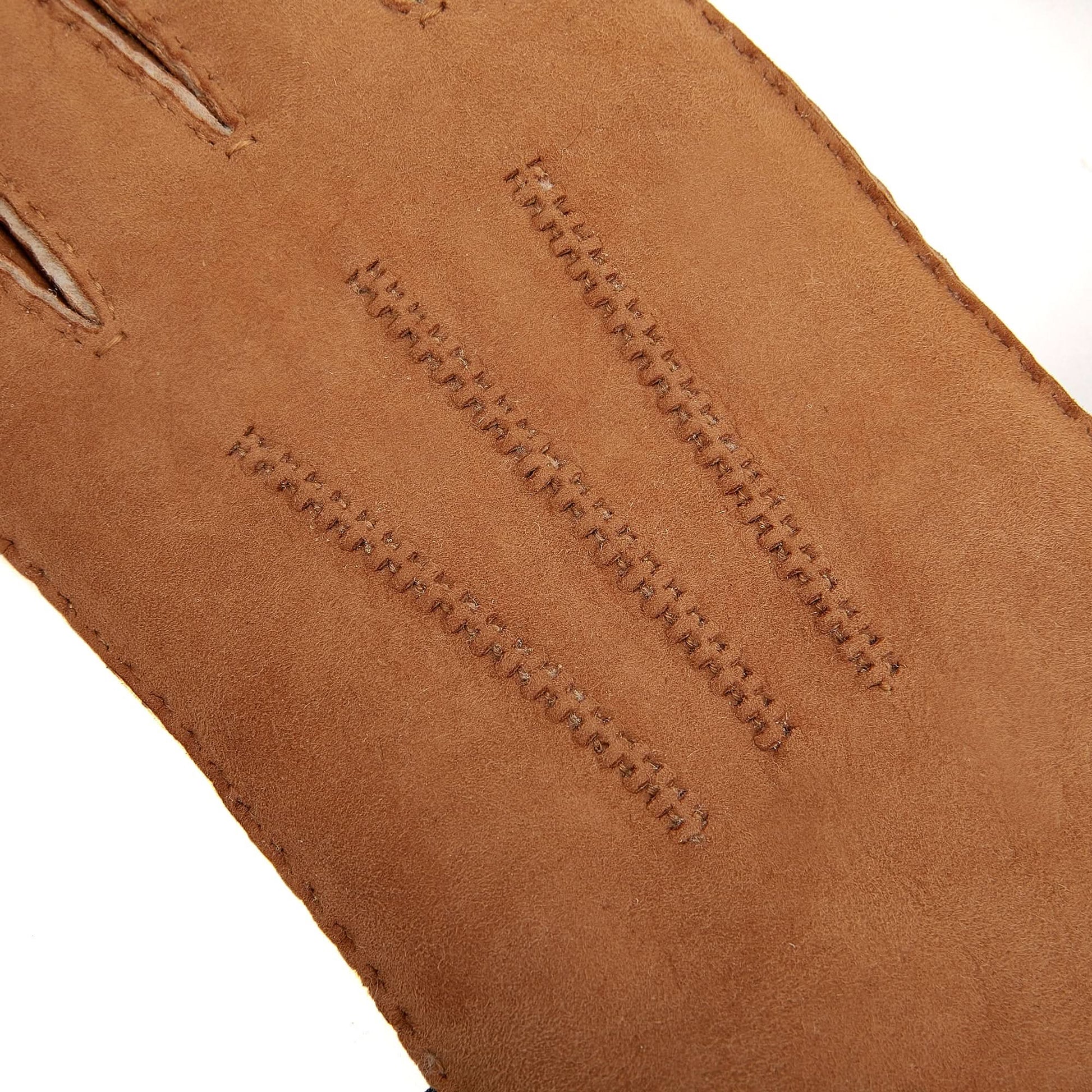 Tan leather wallet with decorative stitching detail, angled top view. - Yellow Earth Australia
