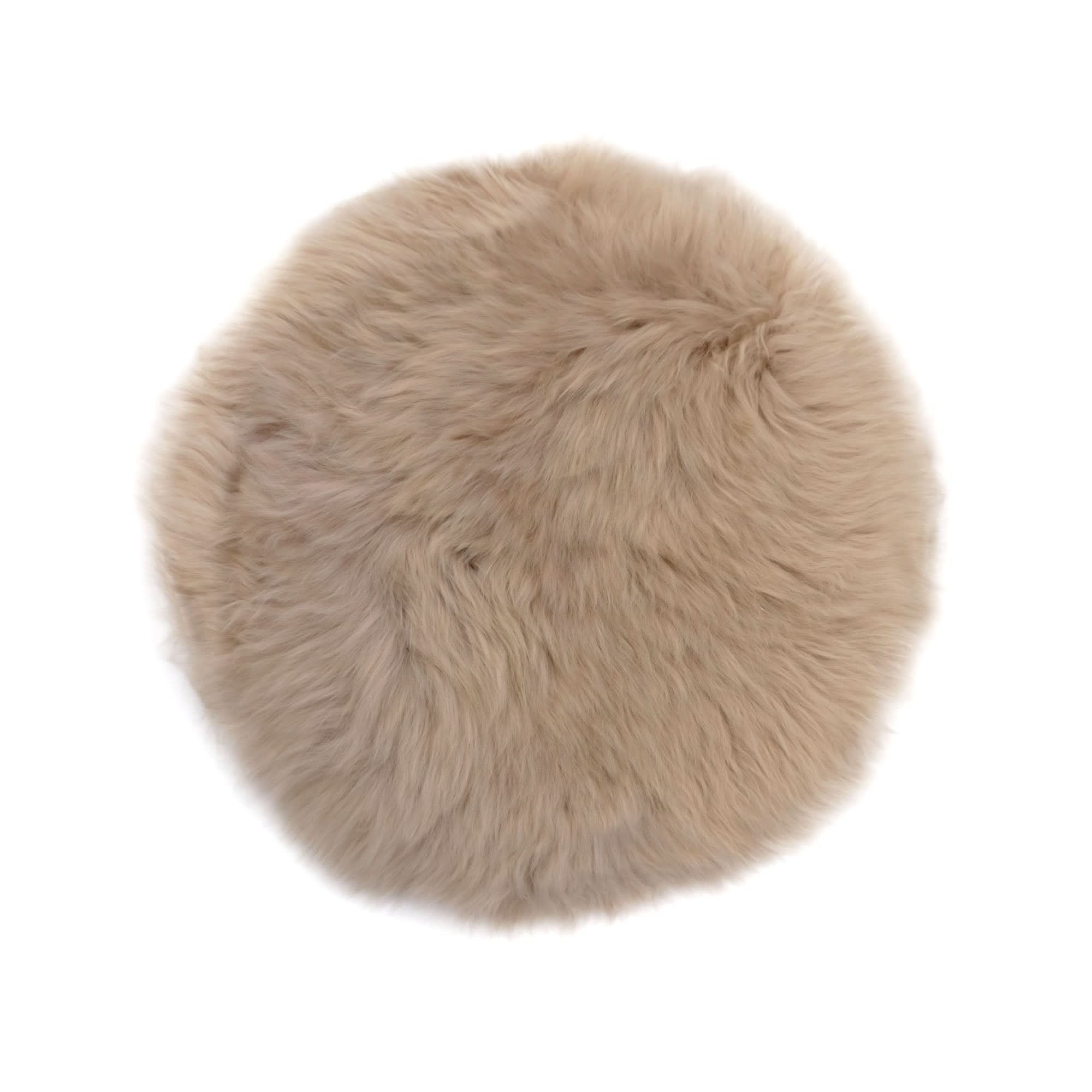 Cream round sheepskin rug with soft wool texture, top view. - Yellow Earth Australia