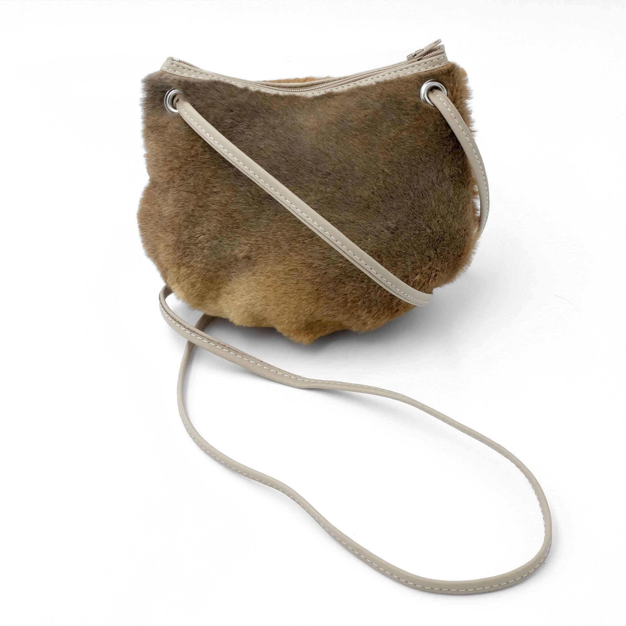 Tan sheepskin shoulder bag with cream leather handles, front angled view. - Yellow Earth Australia