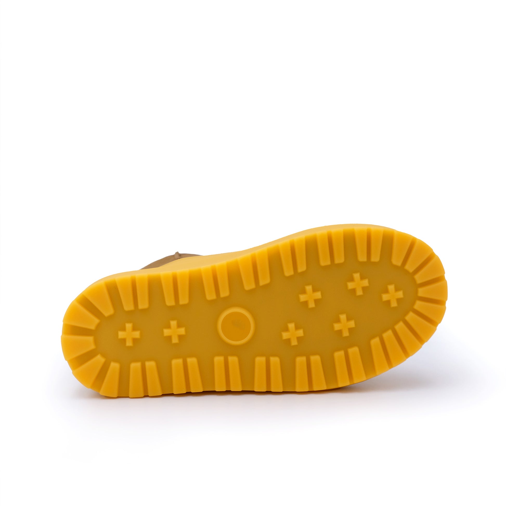 Yellow sheepskin boot sole showing textured rubber tread pattern from underneath. - Yellow Earth Australia