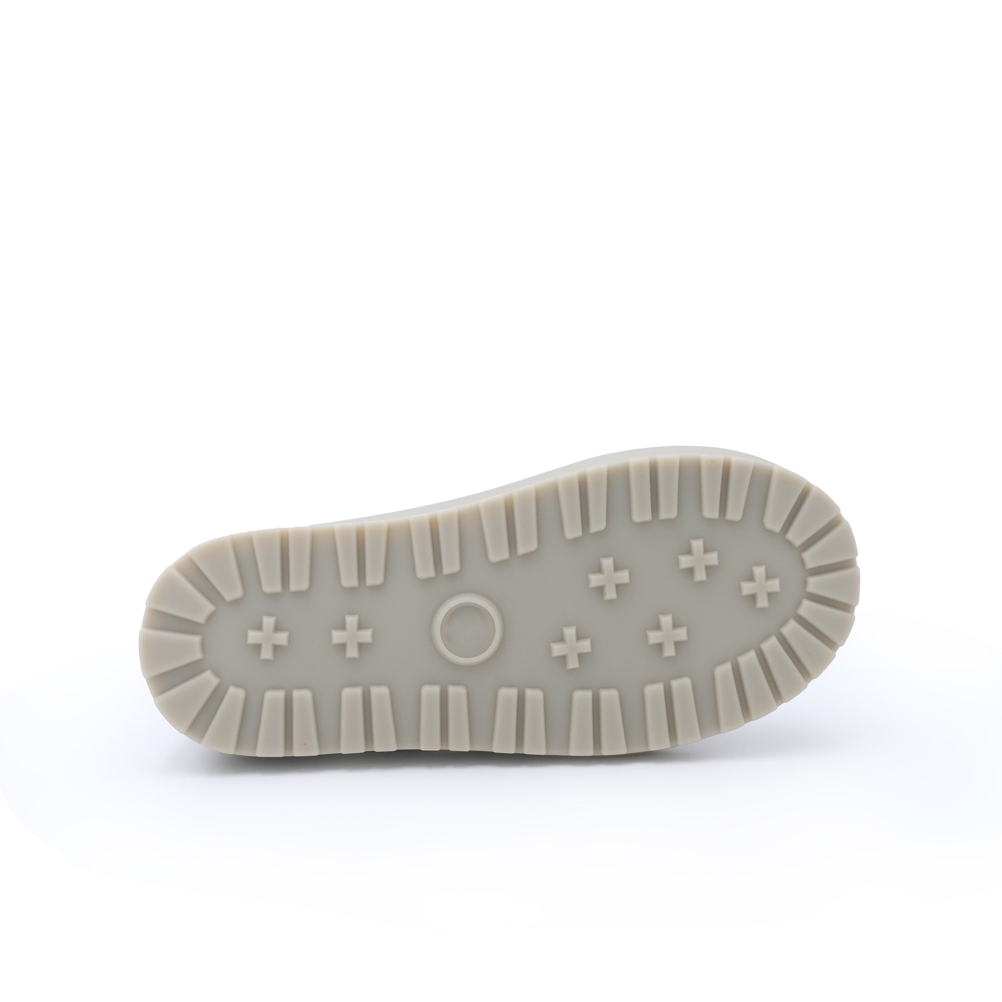 Cream sheepskin boot sole showing tread pattern and textured grip from bottom view. - Yellow Earth Australia