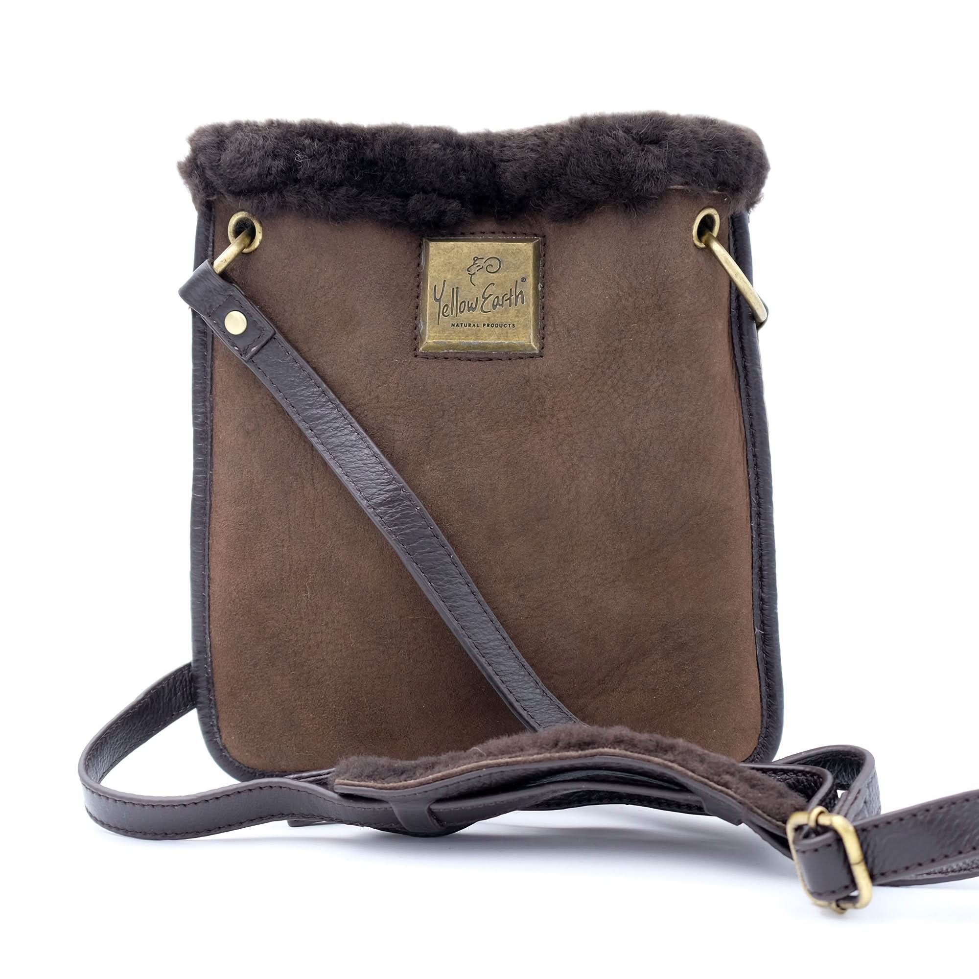 Brown sheepskin shoulder bag with black fur trim and leather strap, front view. - Yellow Earth Australia