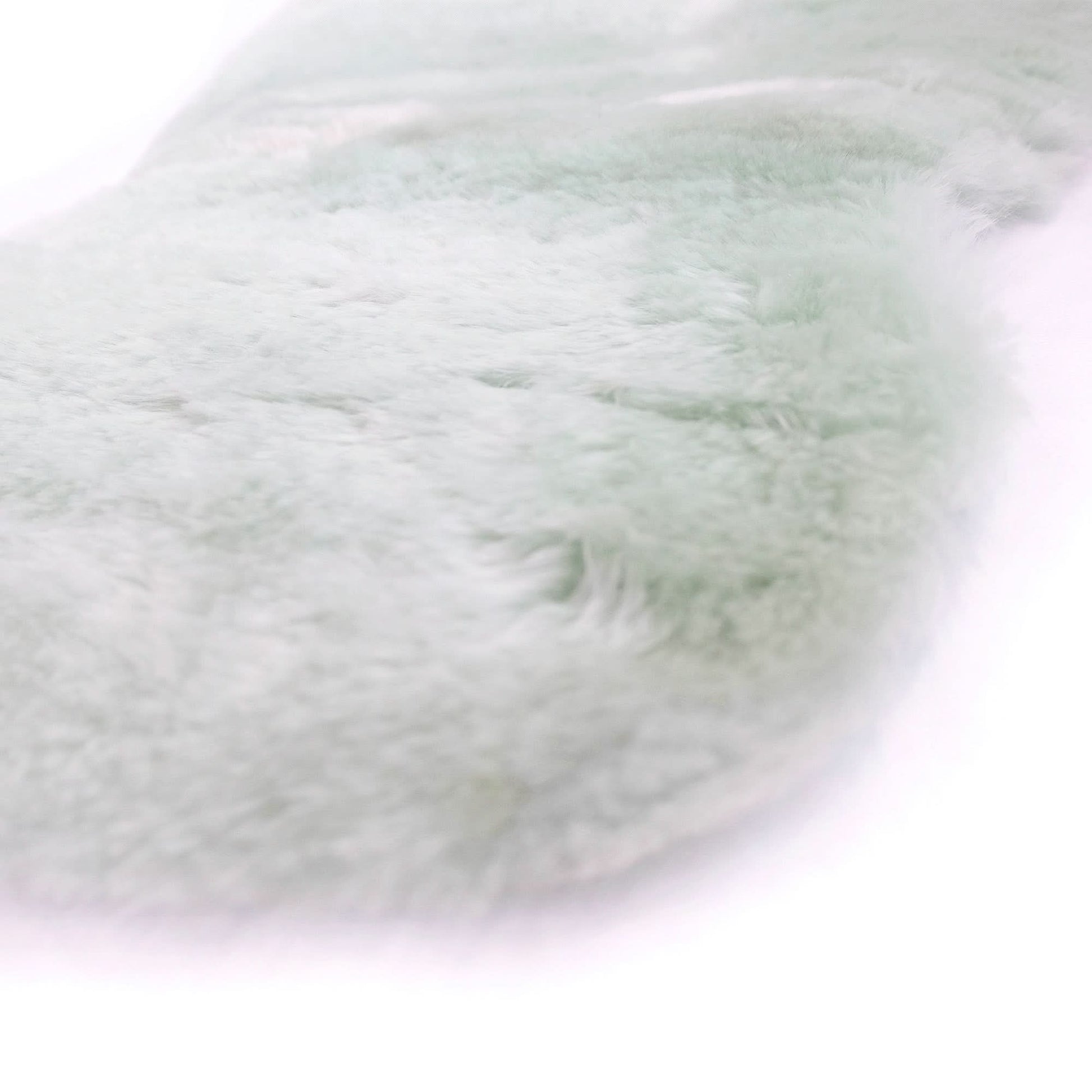 Soft white sheepskin rug with fluffy wool texture, top-down view. - Yellow Earth Australia