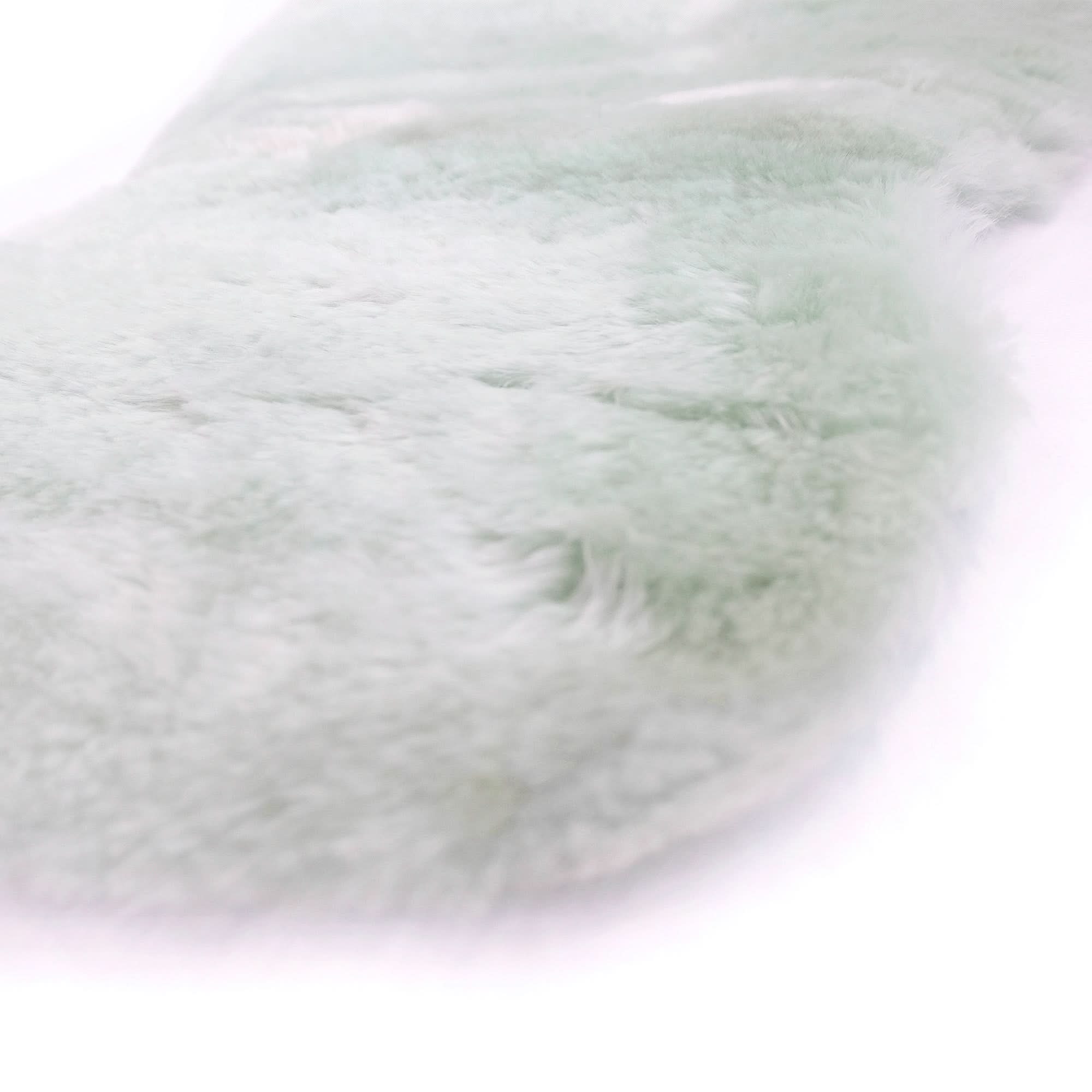 Soft white sheepskin rug with fluffy wool texture, top-down view. - Yellow Earth Australia