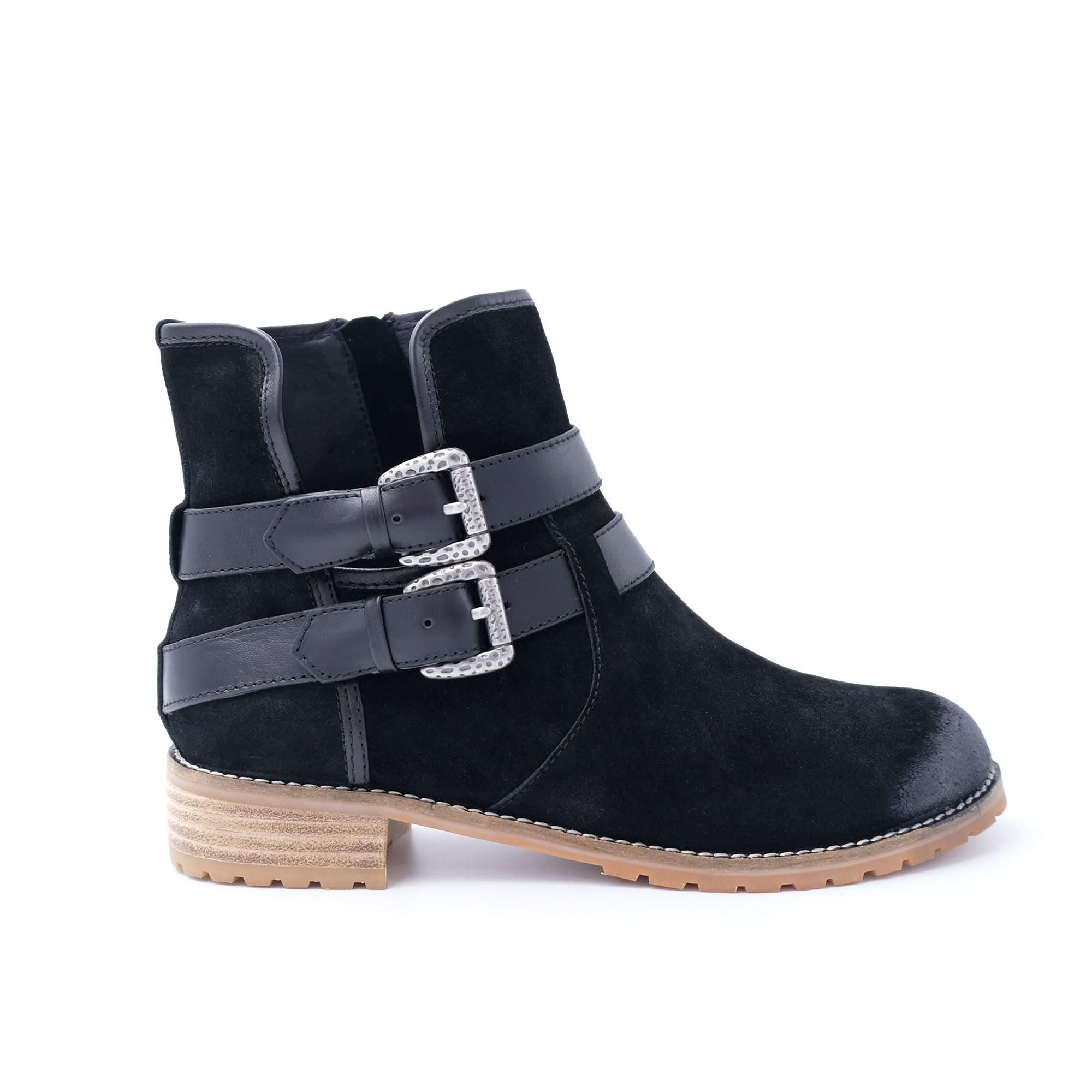 Black suede ankle boot with dual buckle straps and tan lug sole, side view. - Yellow Earth Australia
