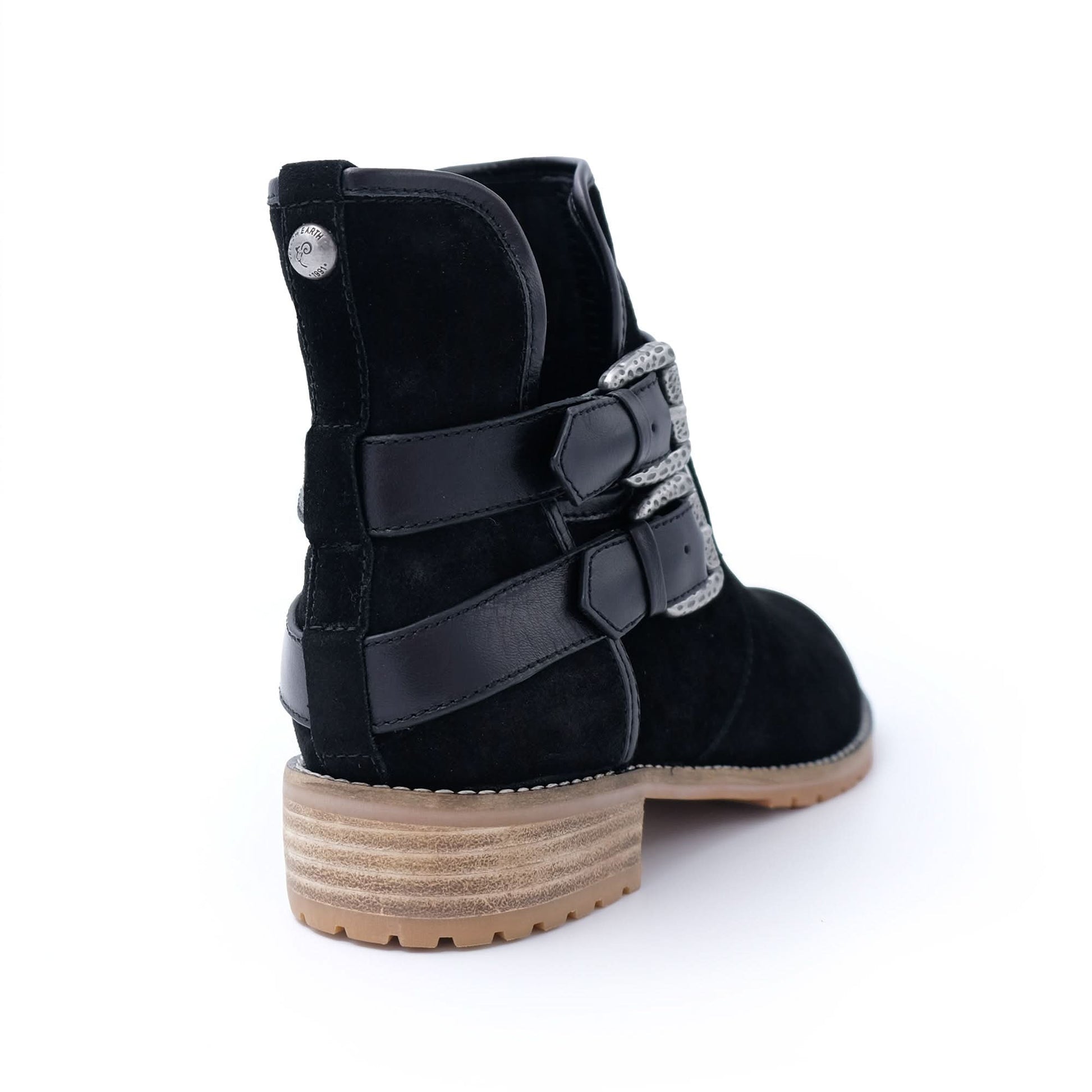 Black suede sheepskin boot with buckle straps and tan lug sole, rear view. - Yellow Earth Australia