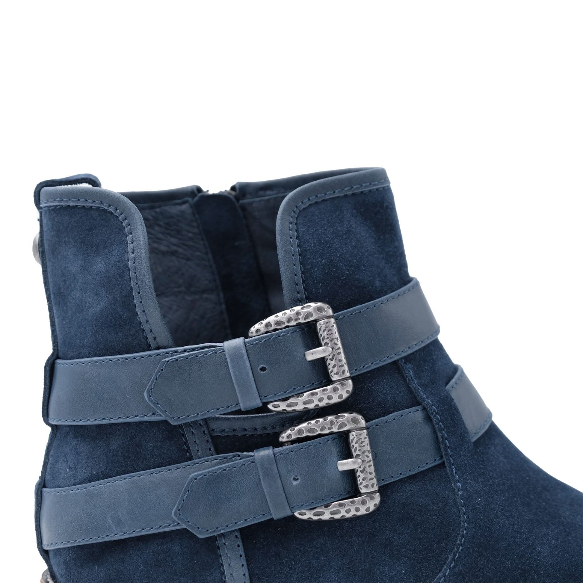 Navy blue suede ankle boot with dual decorative silver buckles and leather straps