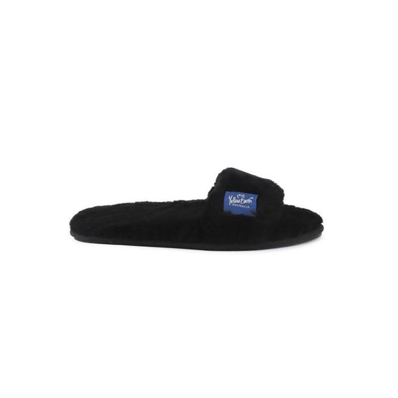 Black sheepskin slider slipper with fluffy wool lining, side view. - Yellow Earth Australia